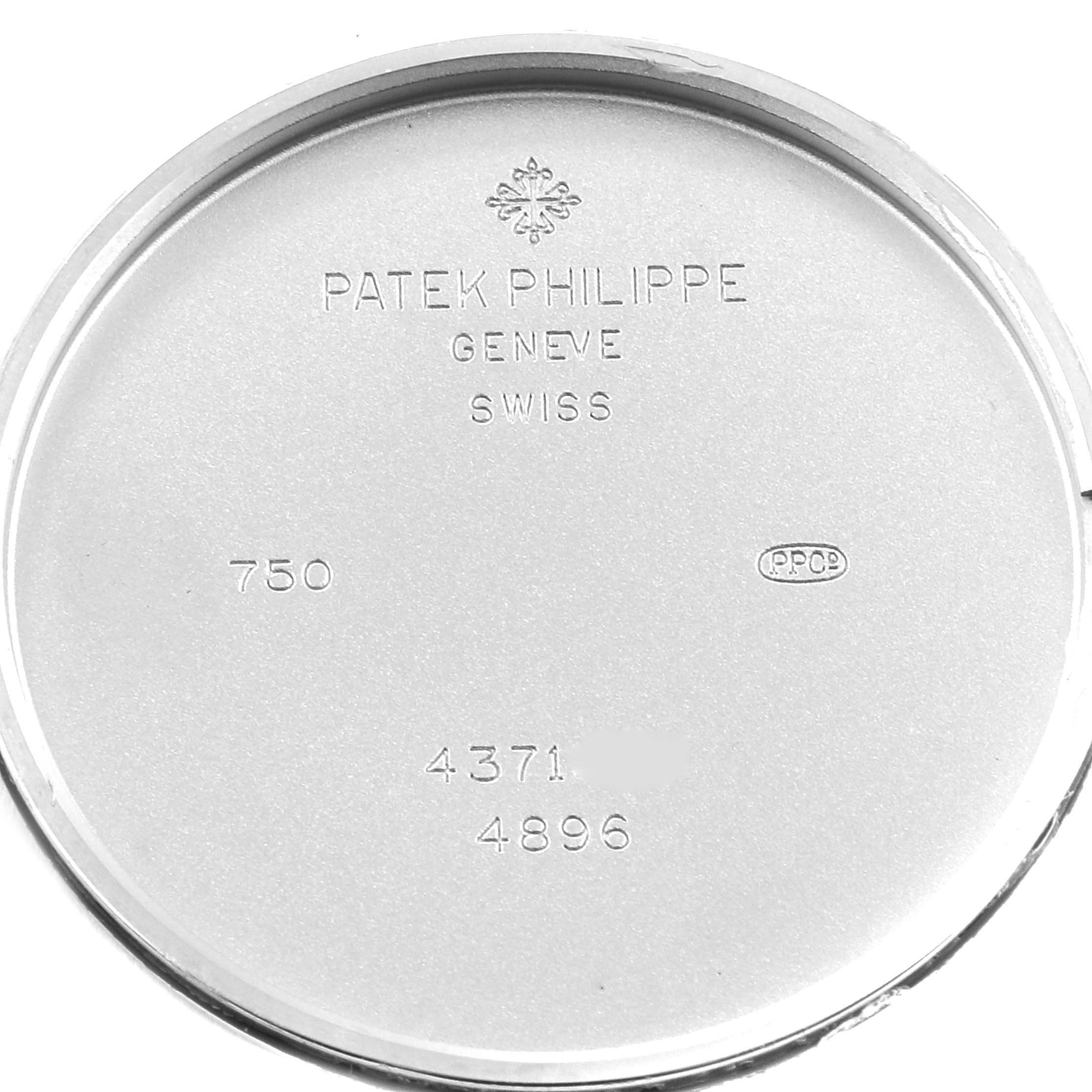 This image shows the inner case back of a Patek Philippe Calatrava 4896G Women's White Gold Blue Dial 4896G Women's White Gold Blue Dial watch, displaying engraved model details and brand information.