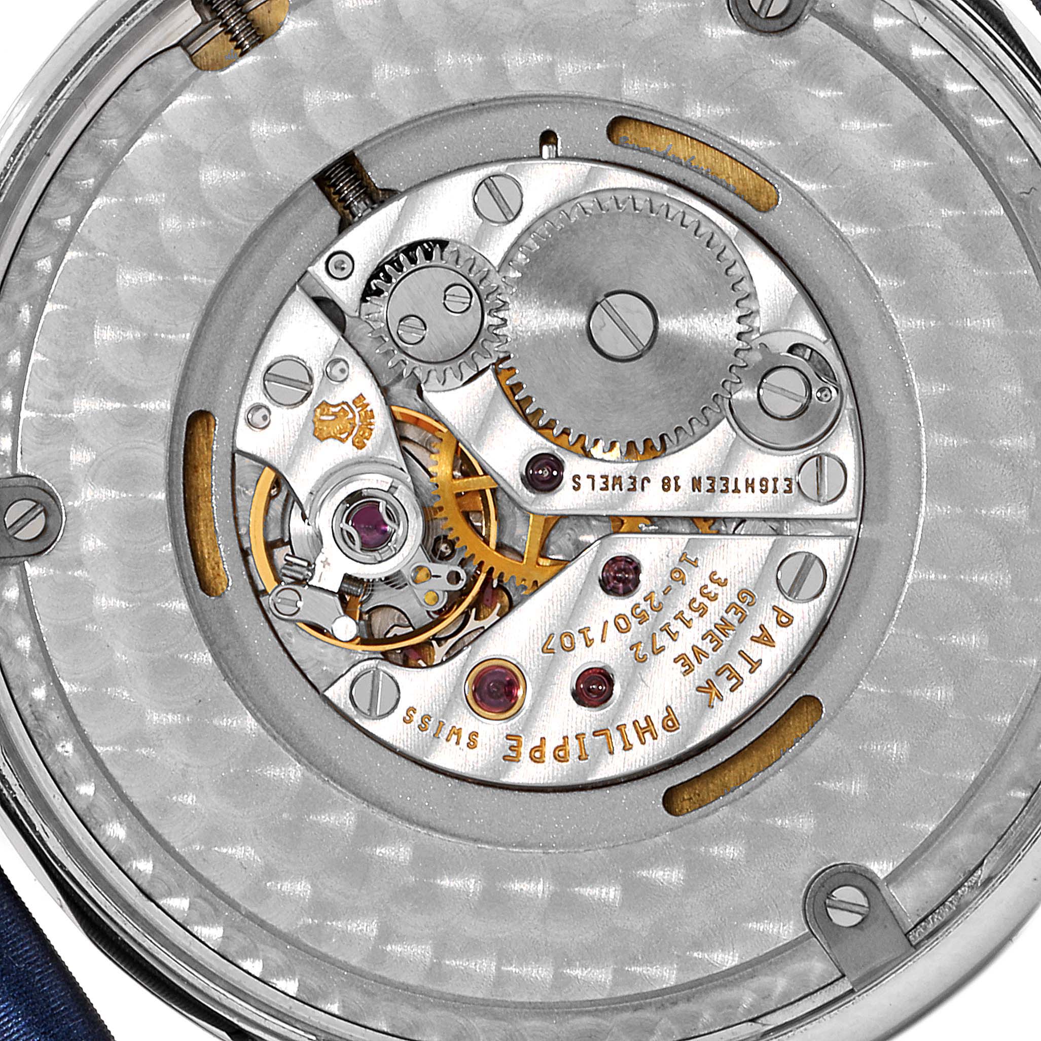 This image shows the intricate internal movement of a Patek Philippe Calatrava 4896G Men's White Gold Blue Dial 4896G Men's White Gold Blue Dial watch, showcasing its gears and mechanical components from the back.