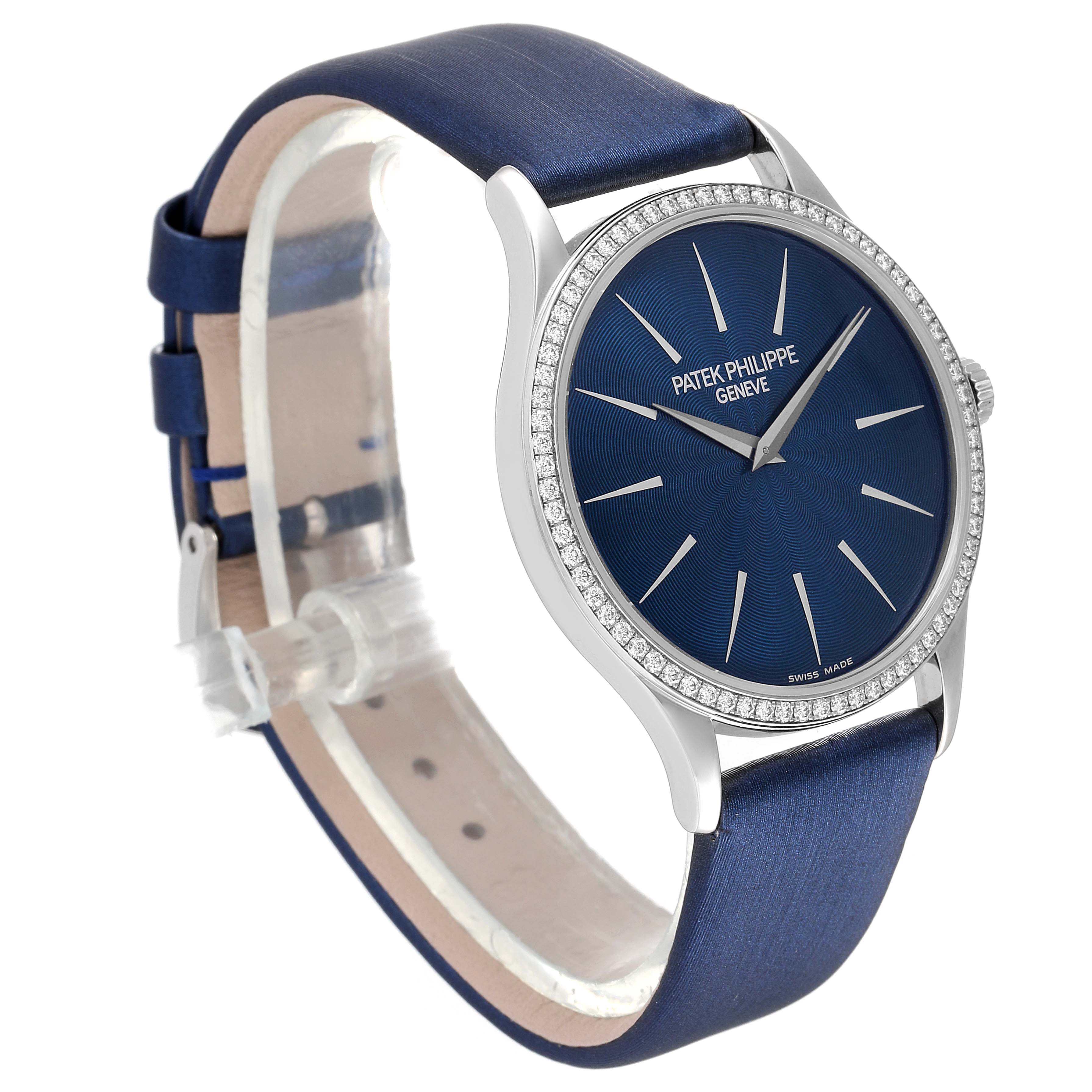 The image shows a side view of the Patek Philippe Calatrava 4896G Men's White Gold Blue Dial 4896G Men's White Gold Blue Dial watch, highlighting its blue dial, silver hands, and bezel with diamonds.