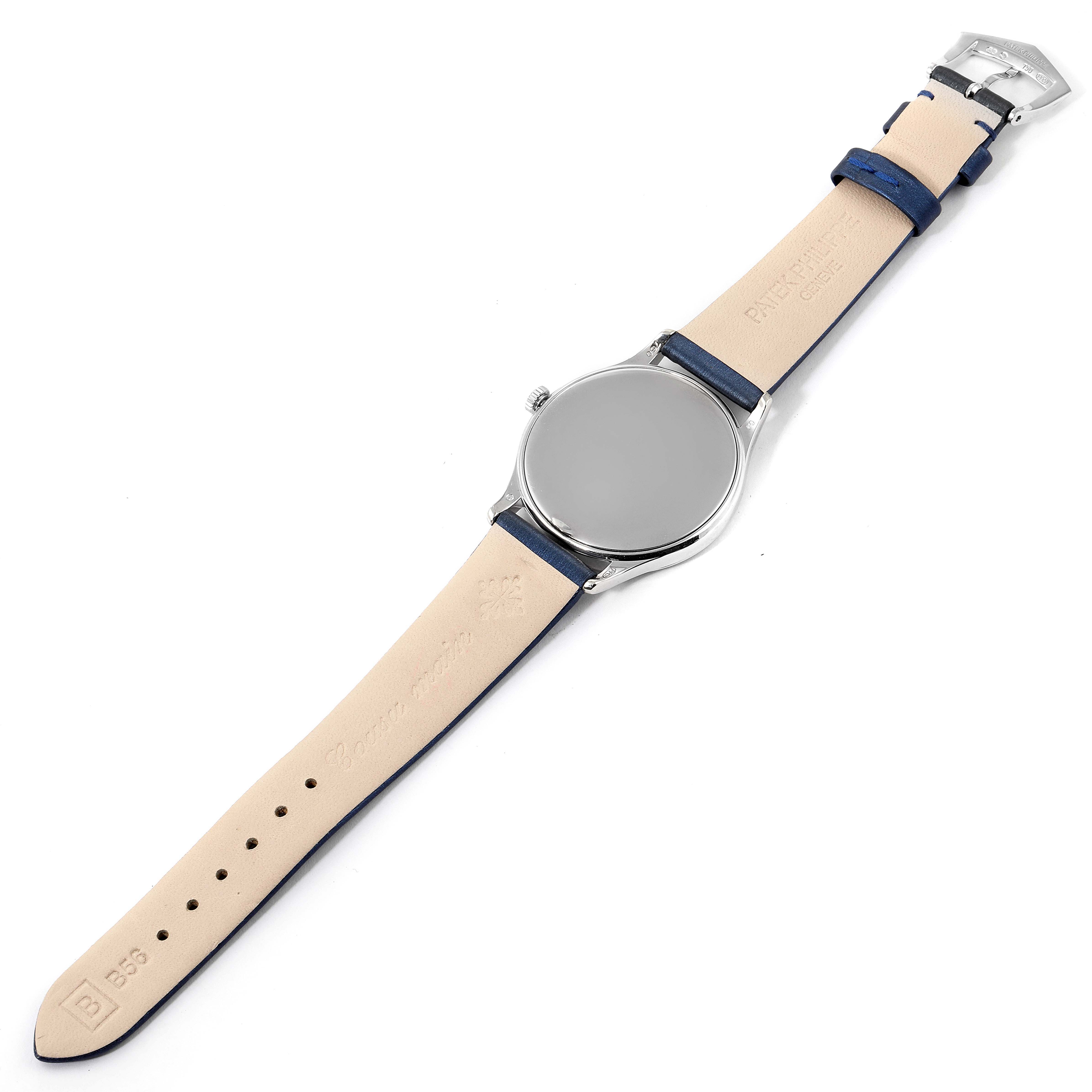 The image shows the underside of a Patek Philippe Calatrava 4896G Men's White Gold Blue Dial 4896G Men's White Gold Blue Dial watch, displaying the leather strap and back of the watch face.