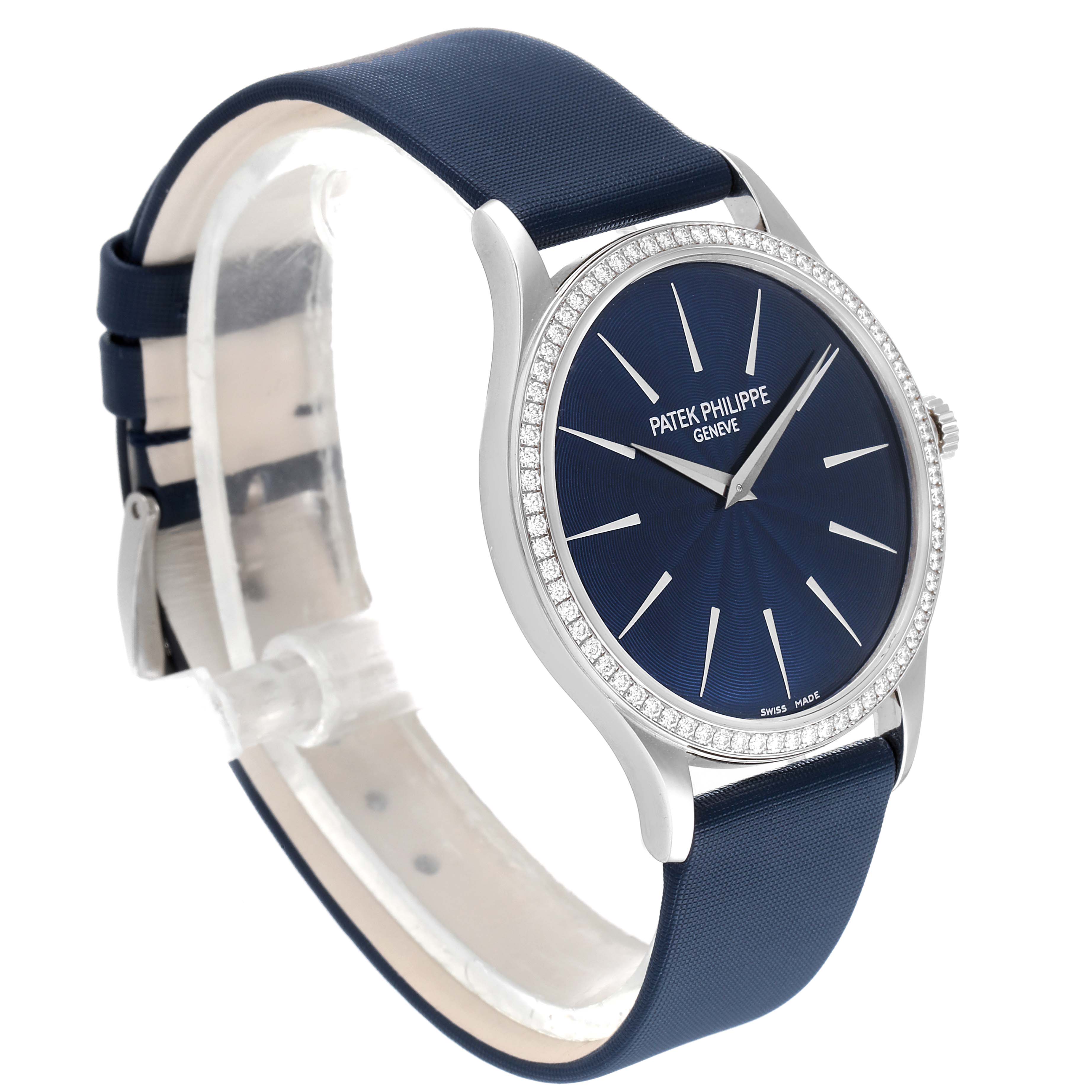 The image shows a Patek Philippe Calatrava 4897G-001 Women's White Gold Blue Dial 4897G-001 Women's White Gold Blue Dial watch at a three-quarter angle, highlighting its blue dial, diamond bezel, and blue strap.