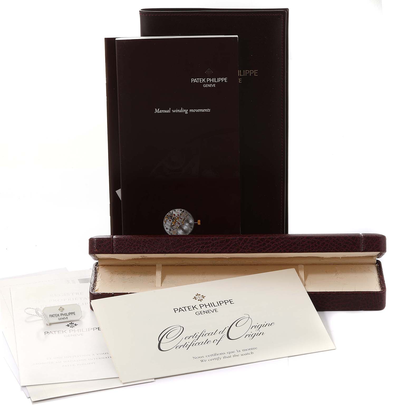 The image shows the packaging and documents, including a certificate and manual, for a Patek Philippe Calatrava 3919G-001 Men
s White Gold White Dial 3919G-001 Men
s White Gold White Dial watch.