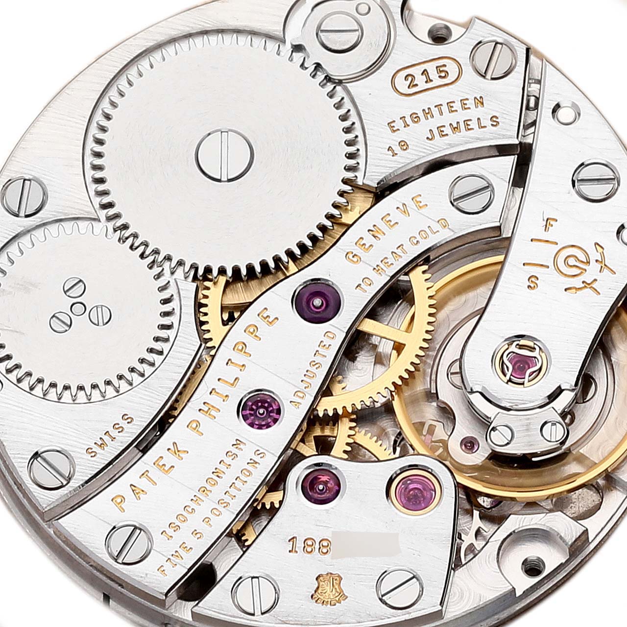 Close-up view of the movement of a Patek Philippe Calatrava 3919G-001 Men
s White Gold White Dial 3919G-001 Men
s White Gold White Dial watch, showcasing gears, jewels, and engravings.
