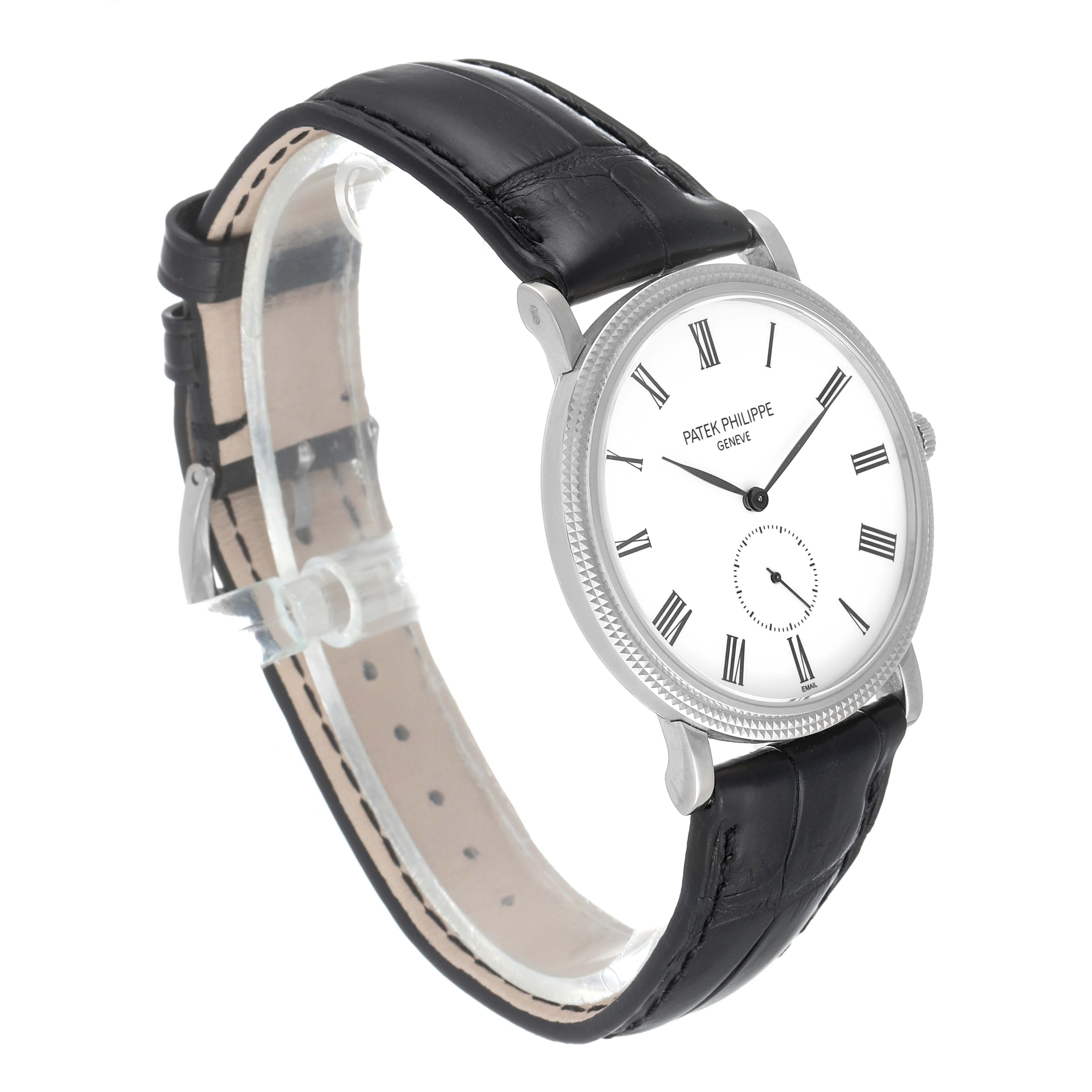 This Patek Philippe Calatrava 5116G Men
s White Gold White Dial 5116G Men
s White Gold White Dial watch is shown from a three-quarter angle, highlighting the face, case, and leather strap.