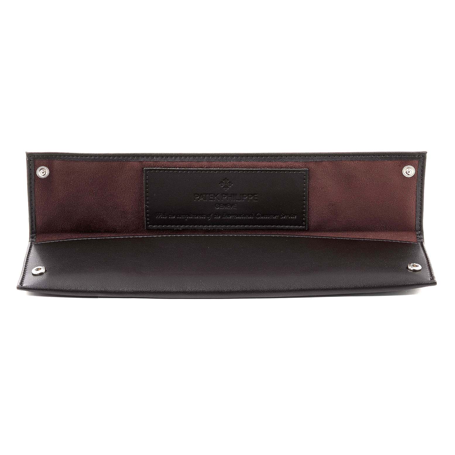 This image shows an open leather watch case for a Patek Philippe Calatrava 5116G Men
s White Gold White Dial 5116G Men
s White Gold White Dial model, displaying the interior with branding.