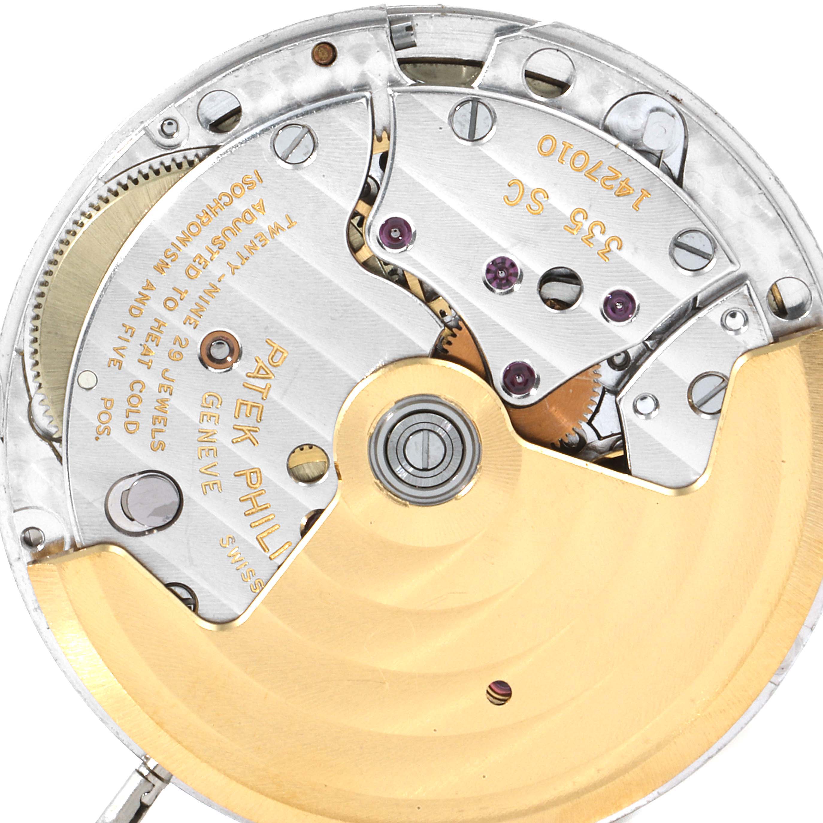 This image shows an internal close-up view of the movement mechanism for a Patek Philippe Nautilus 3800/1AJ Men's Steel and Gold (two tone) Champagne Dial 3800/1AJ Men's Steel and Gold (two tone) Champagne Dial watch.
