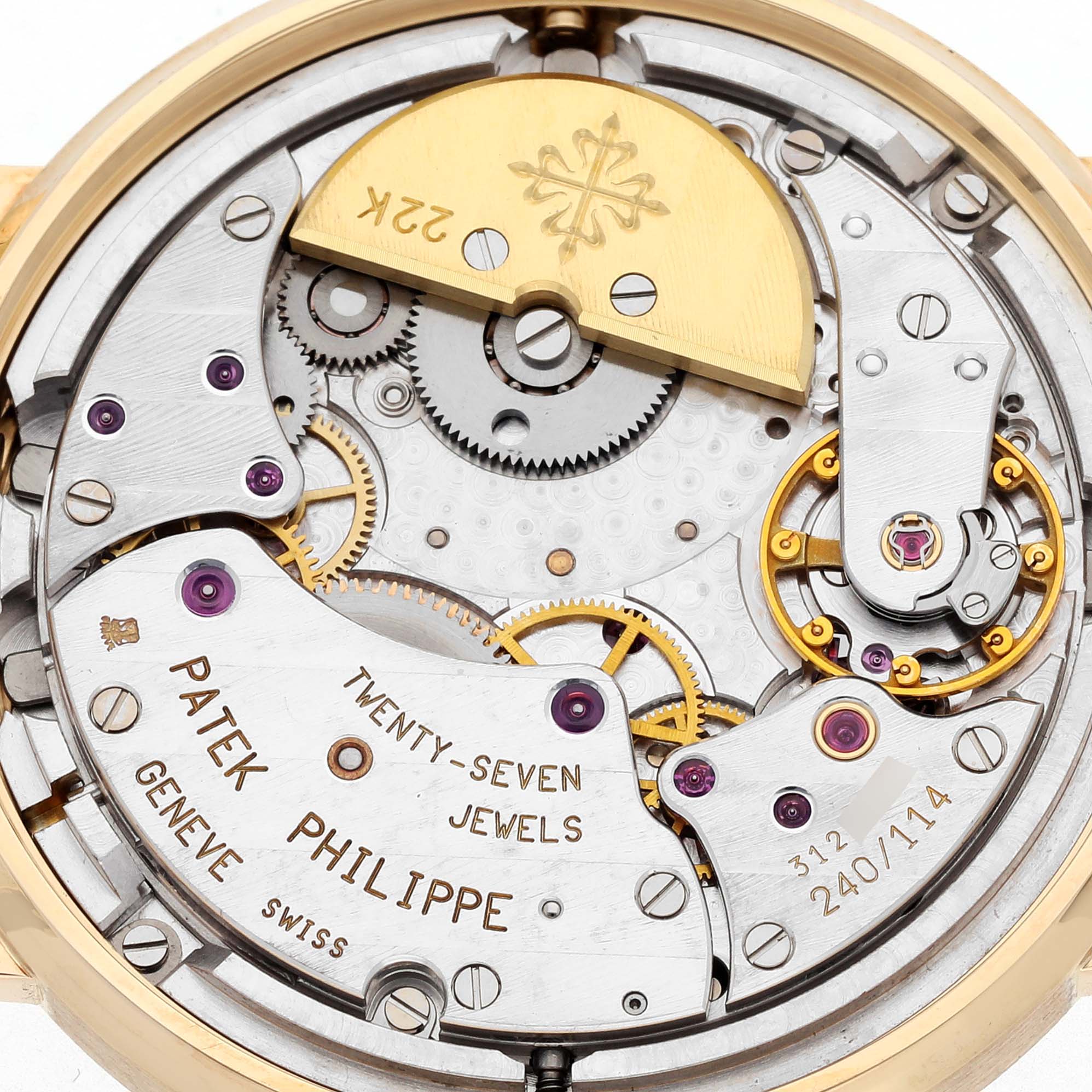 The image shows the back of a Patek Philippe Complications 5039J-001 Men's Yellow Gold Silver Dial 5039J-001 Men's Yellow Gold Silver Dial watch, highlighting the intricate mechanical movement and rotor.