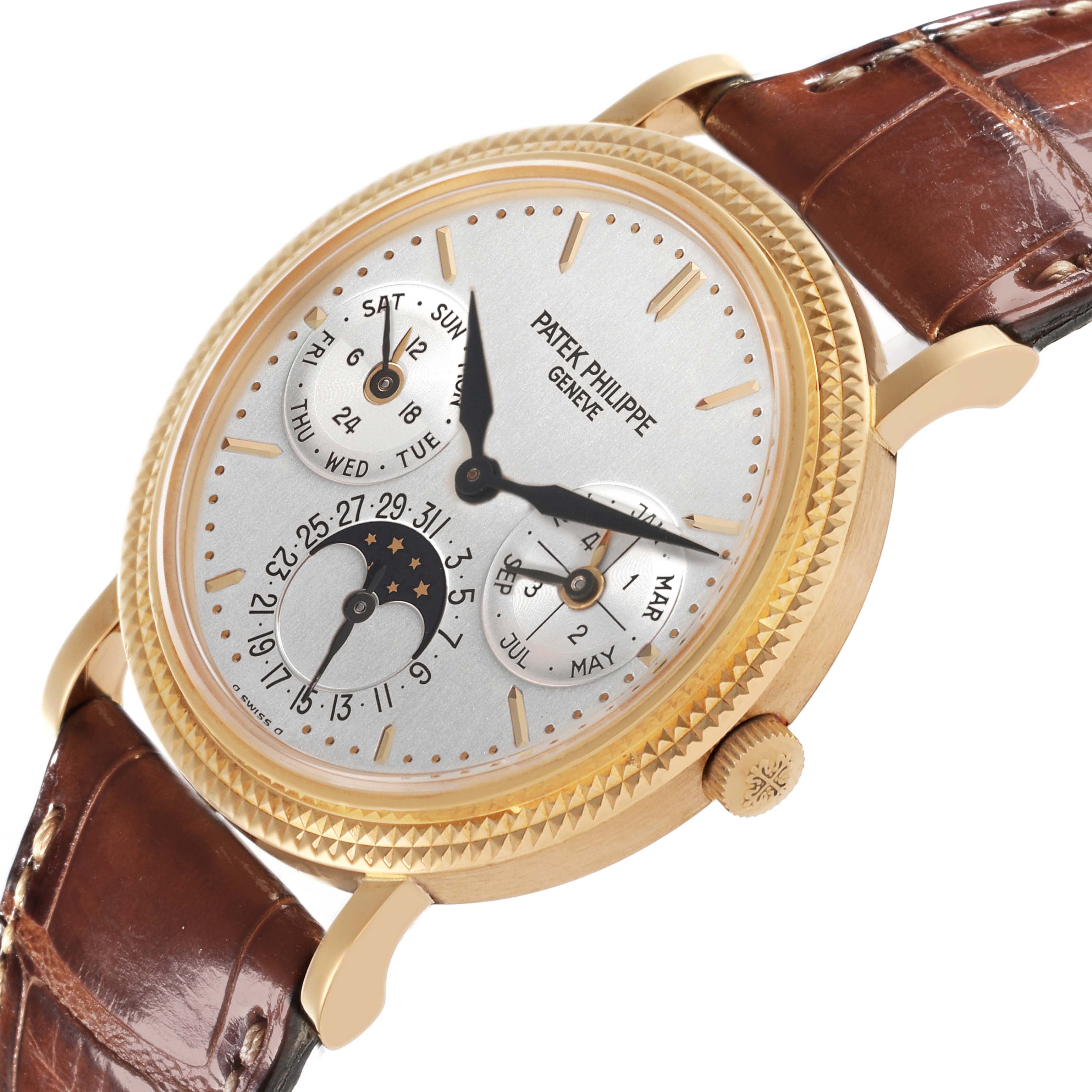 The Patek Philippe Complications 5039J-001 Men's Yellow Gold Silver Dial 5039J-001 Men's Yellow Gold Silver Dial watch is shown at an oblique angle, highlighting the face, crown, and brown leather strap.