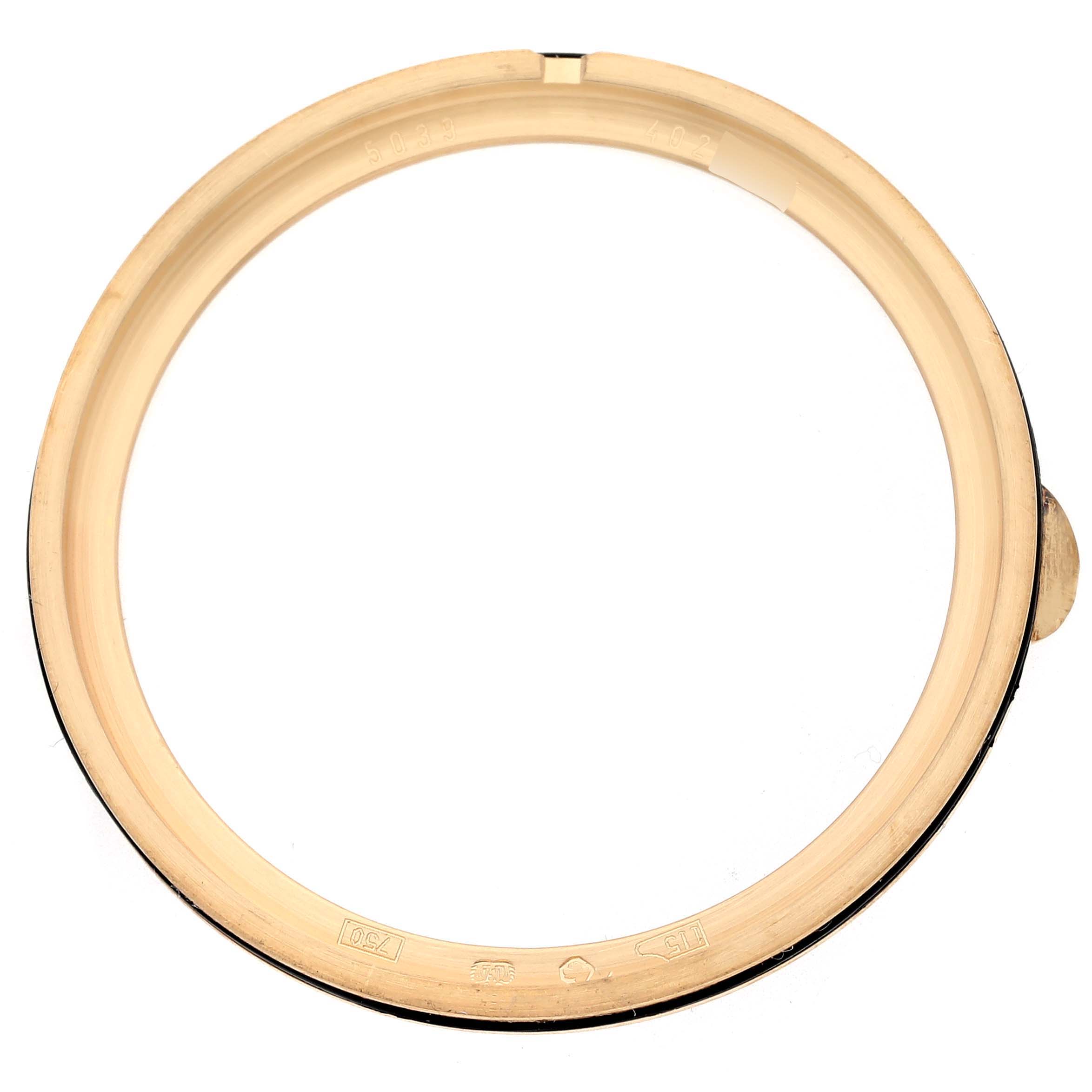 This image shows the bezel of a Patek Philippe Complications 5039J-001 Men's Yellow Gold Silver Dial 5039J-001 Men's Yellow Gold Silver Dial watch from a top-down angle.