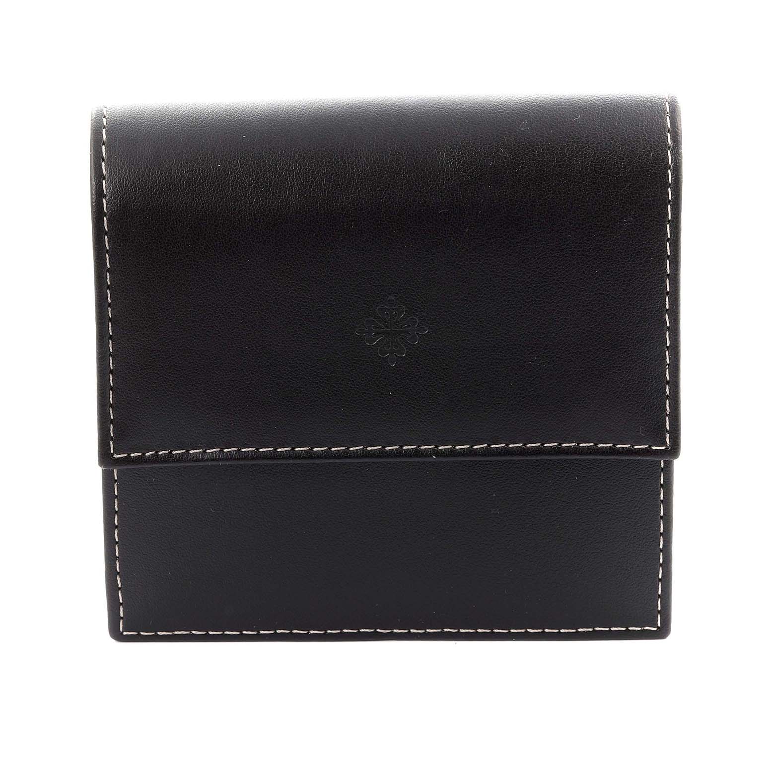 The image shows a closed leather case for the Patek Philippe Complications 5039J-001 Men's Yellow Gold Silver Dial 5039J-001 Men's Yellow Gold Silver Dial watch, featuring stitching and an embossed logo.