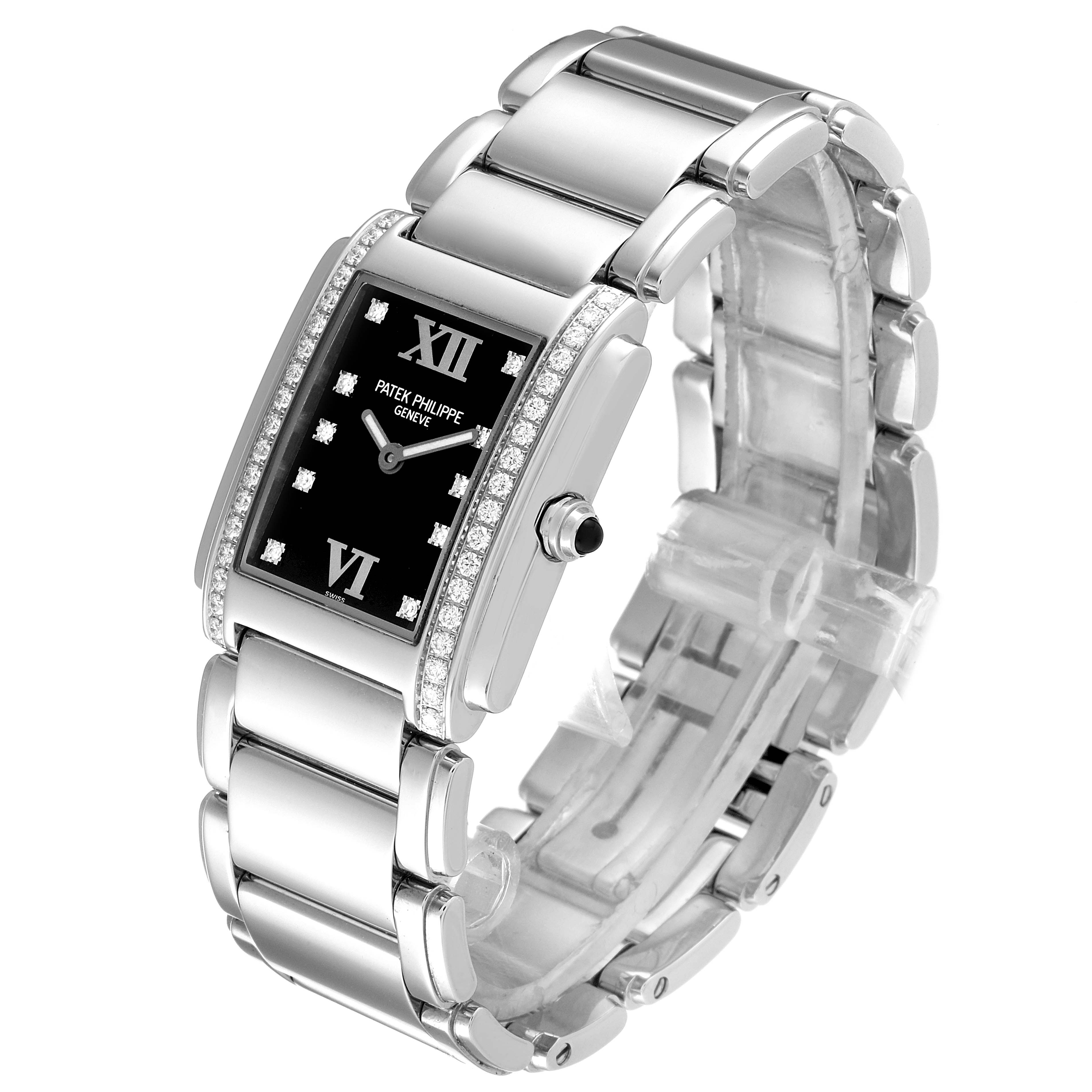This image shows a three-quarter view of the Patek Philippe Twenty-4 4910 Women's Stainless Steel Black Dial 4910 Women's Stainless Steel Black Dial watch, highlighting its black dial, diamond bezel, and stainless steel bracelet.
