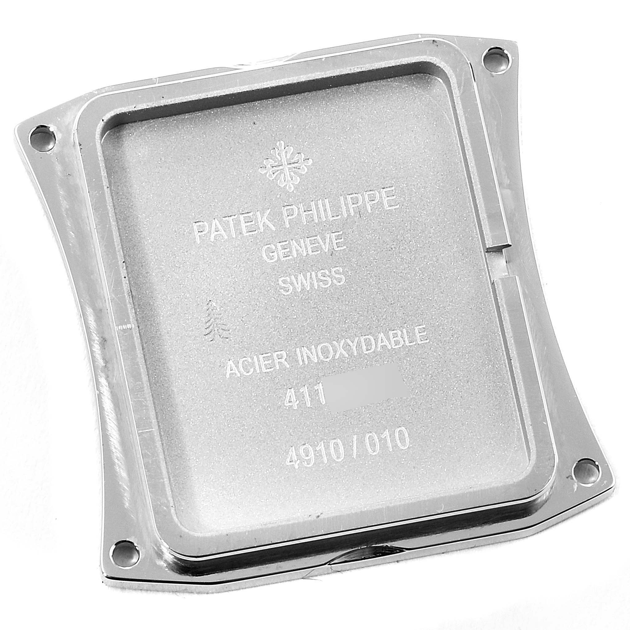 This image shows the case back of a Patek Philippe Twenty-4 4910 Women's Stainless Steel Black Dial 4910 Women's Stainless Steel Black Dial watch from a top-down angle.