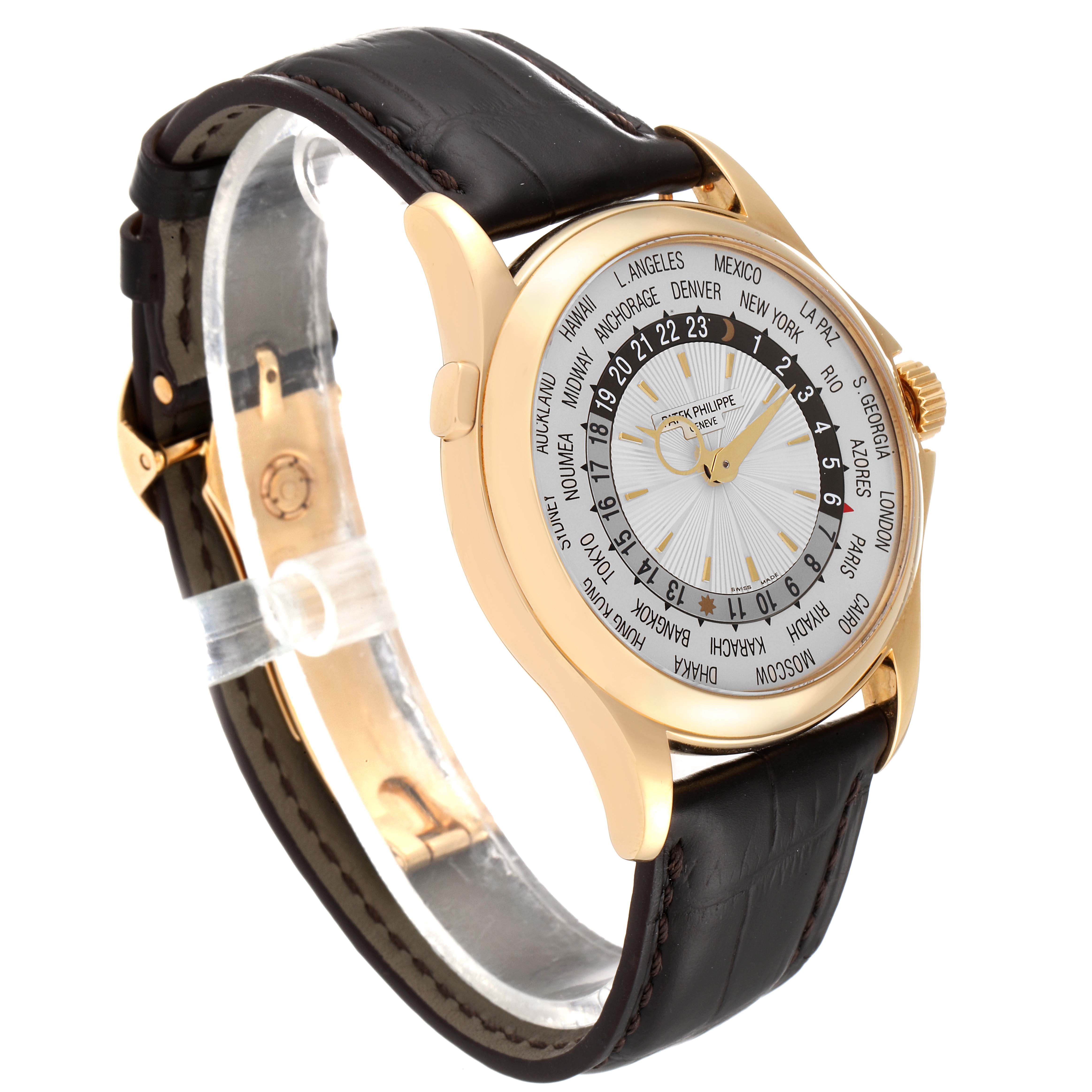 This image shows a Patek Philippe Complications 5130J Men's Yellow Gold Silver Dial 5130J Men's Yellow Gold Silver Dial model watch from a side angle, highlighting the dial, case, and leather strap.