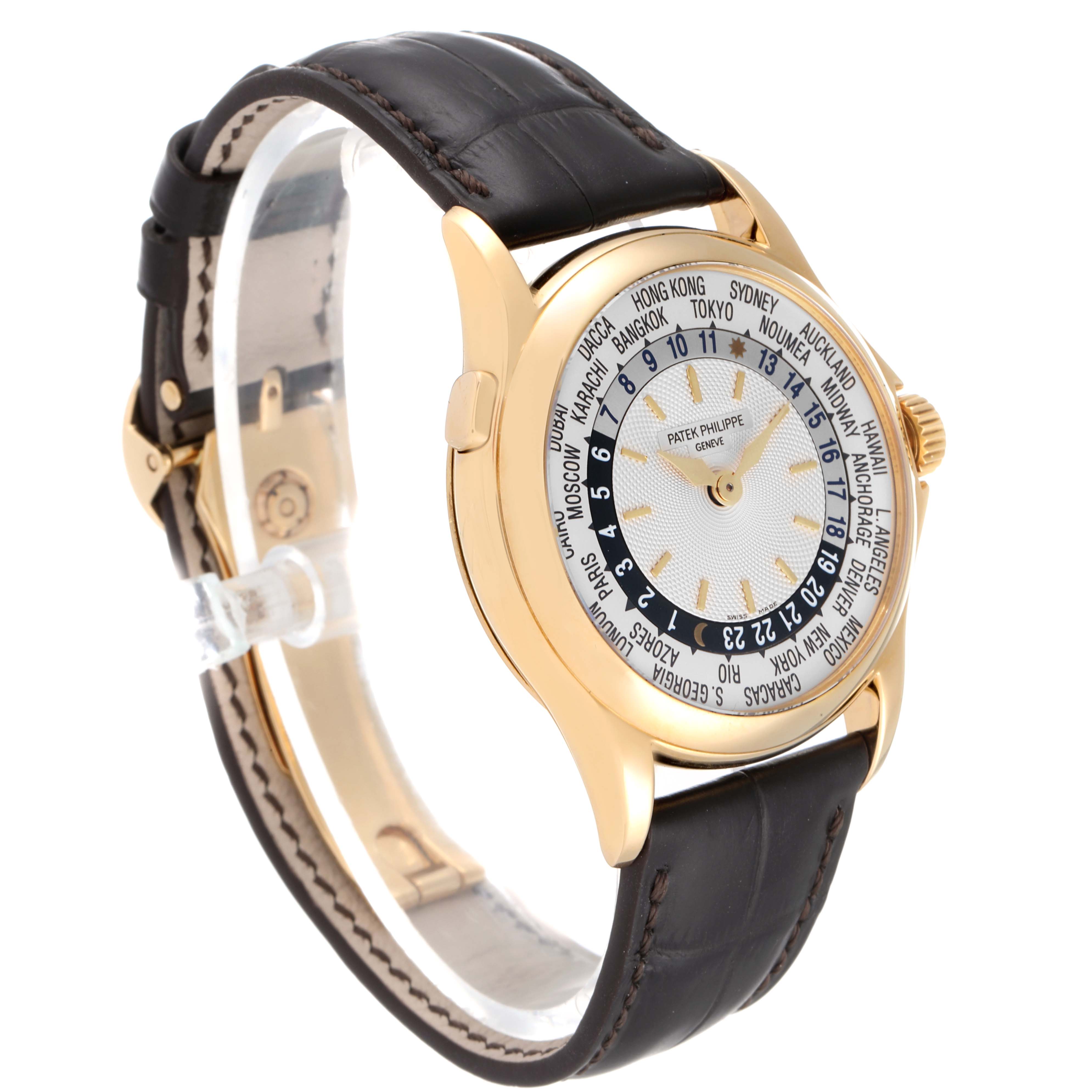 This is a side-angle view of the Patek Philippe Complications 5110J Men's Yellow Gold Silver Dial 5110J Men's Yellow Gold Silver Dial watch, showcasing its gold case, world time dial, and leather strap.