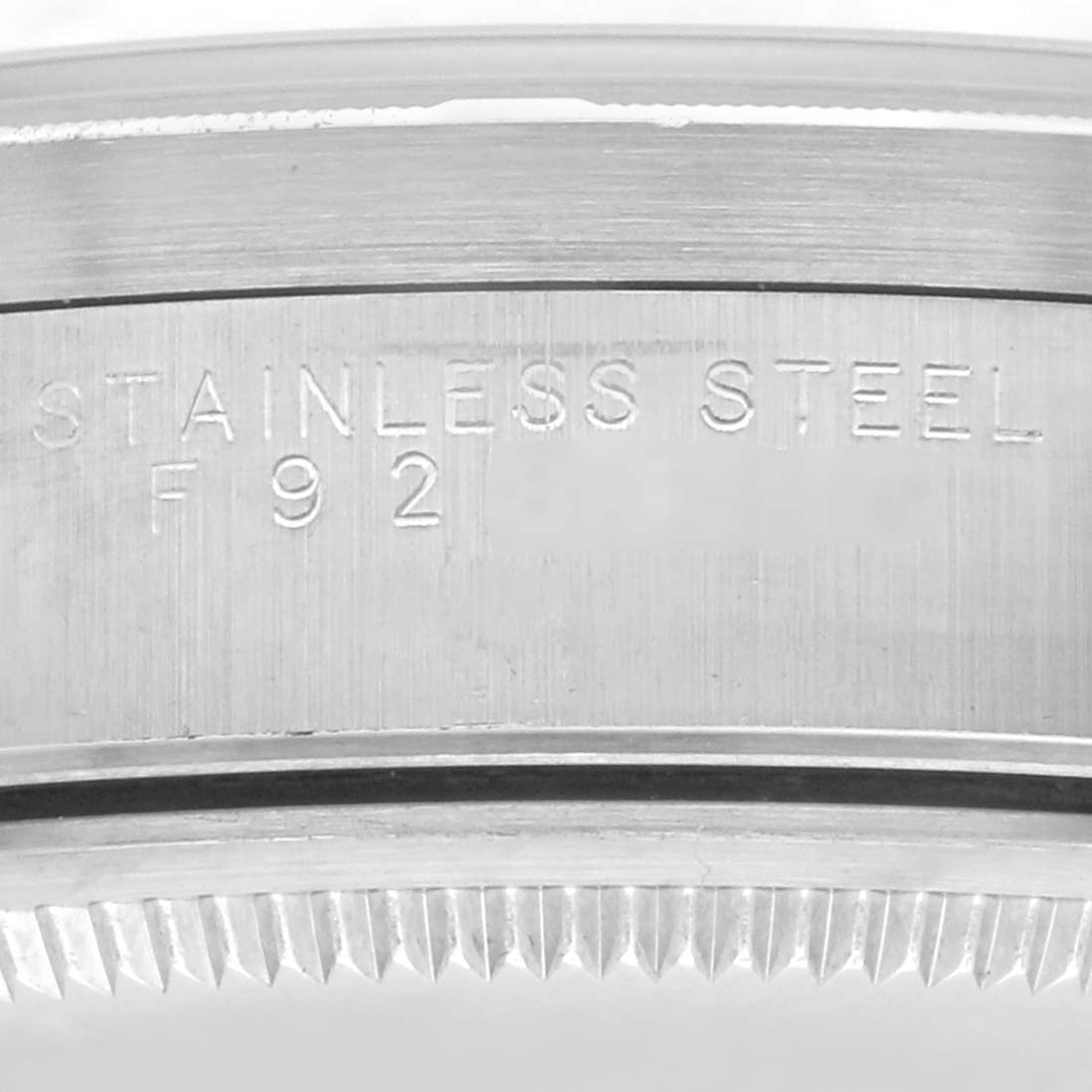 The image shows a close-up of the stainless steel case and bezel edge on a Rolex Air-King 14010 Men's Stainless Steel Black Dial 14010 Men's Stainless Steel Black Dial watch.