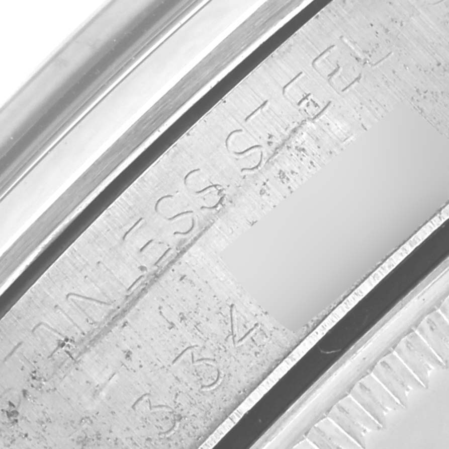 The image shows a close-up of the stainless steel engraving on the side of a Rolex Vintage Collection 5500 Men's Stainless Steel Silver Dial 5500 Men's Stainless Steel Silver Dial watch.