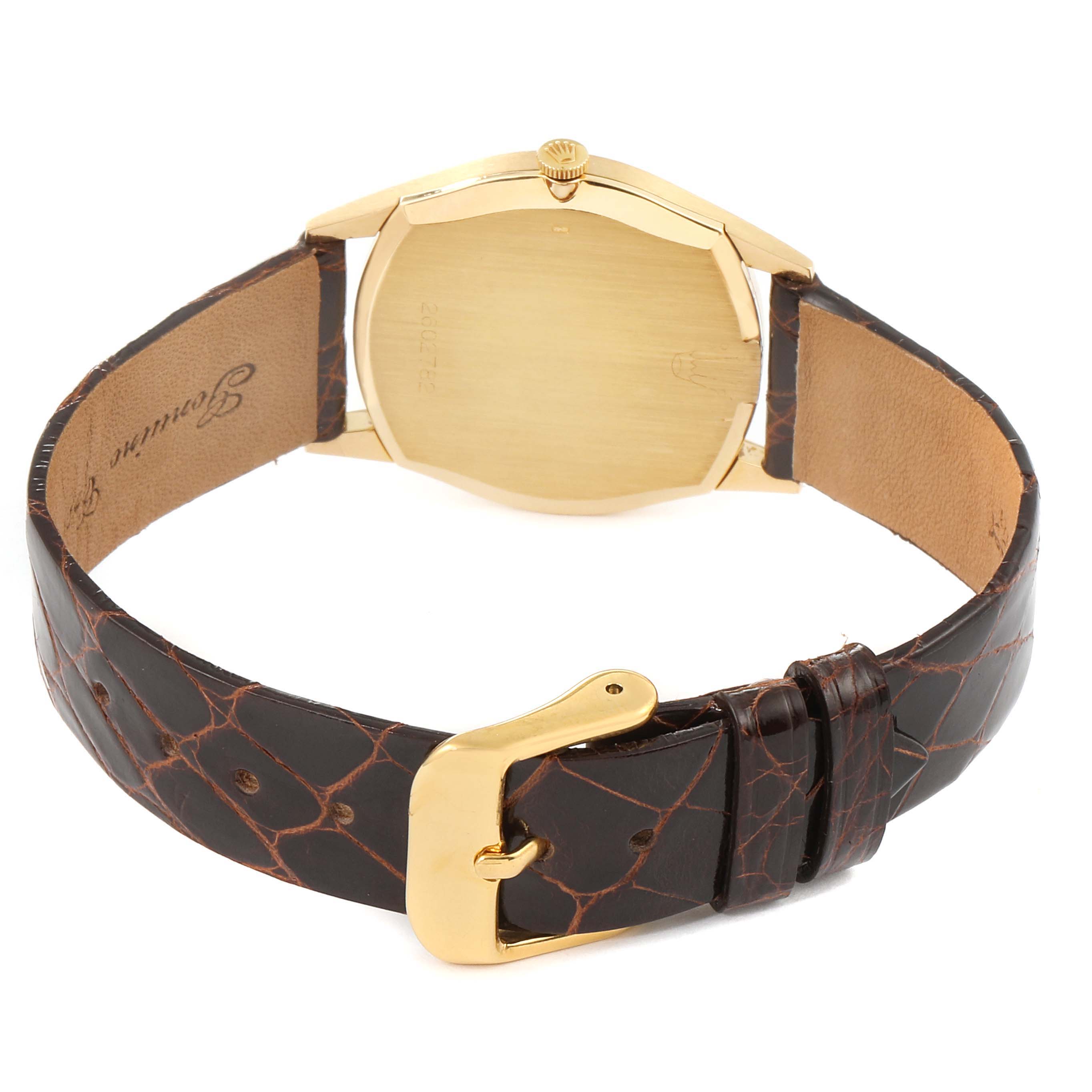 The image shows the rear view of a Rolex Cellini 3804 Men's Yellow Gold Silver Dial 3804 Men's Yellow Gold Silver Dial watch, highlighting its case back, crown, and leather strap with a buckle.