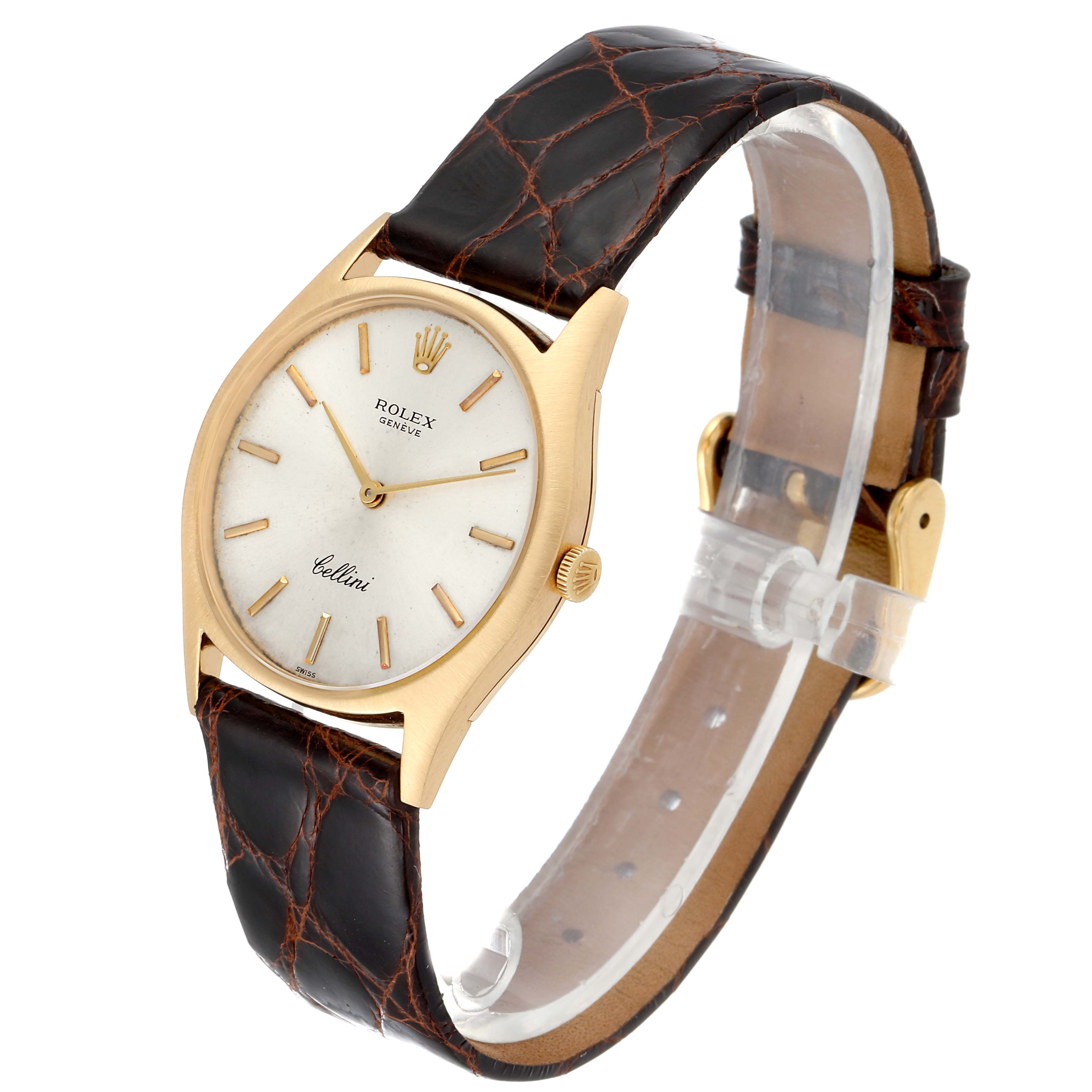 The Rolex Cellini 3804 Men's Yellow Gold Silver Dial 3804 Men's Yellow Gold Silver Dial watch is shown at a slight angle, displaying its face, bezel, crown, and leather strap.
