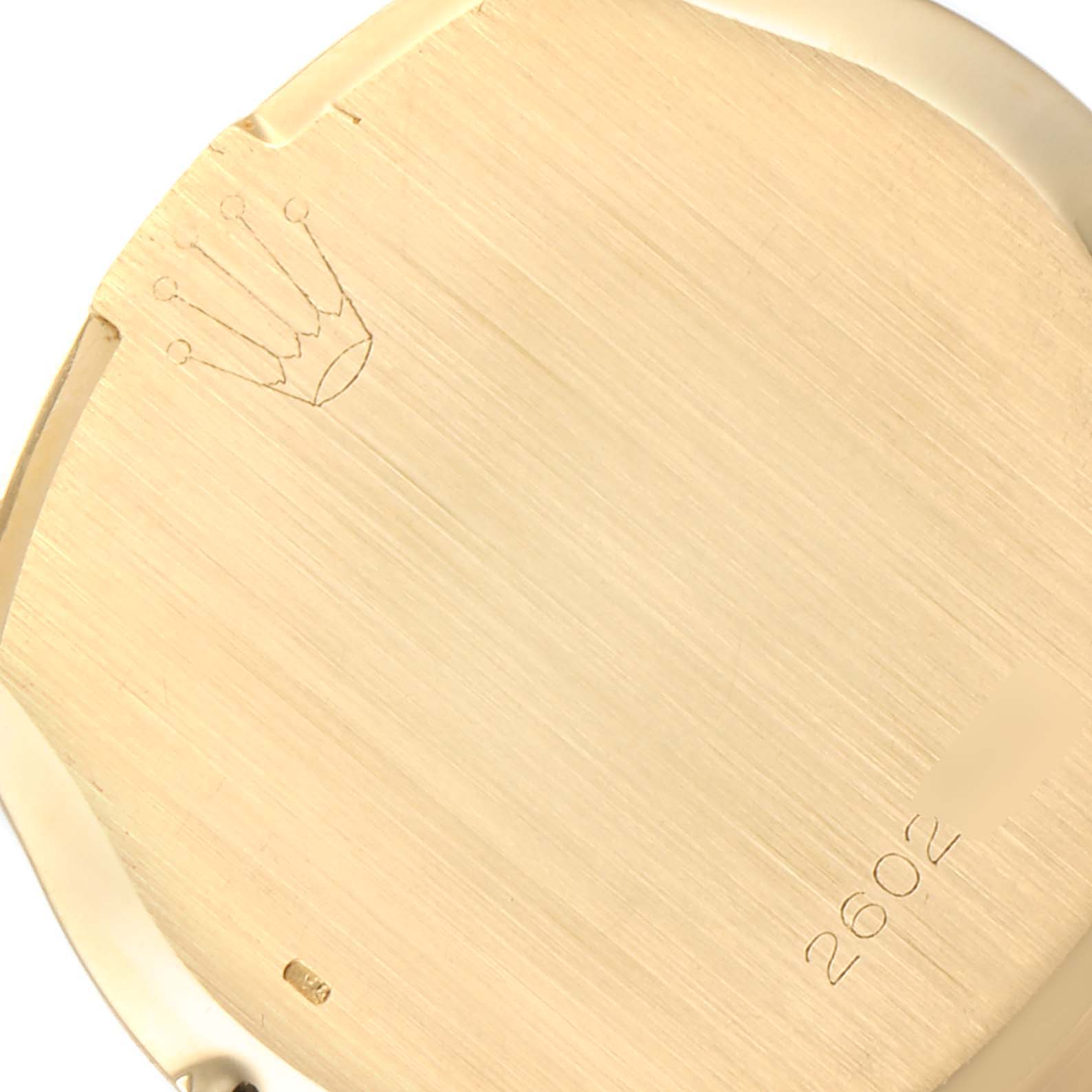 This image shows the backside of the Rolex Cellini 3804 Men's Yellow Gold Silver Dial 3804 Men's Yellow Gold Silver Dial watch case, featuring the brand logo and model number engraving.
