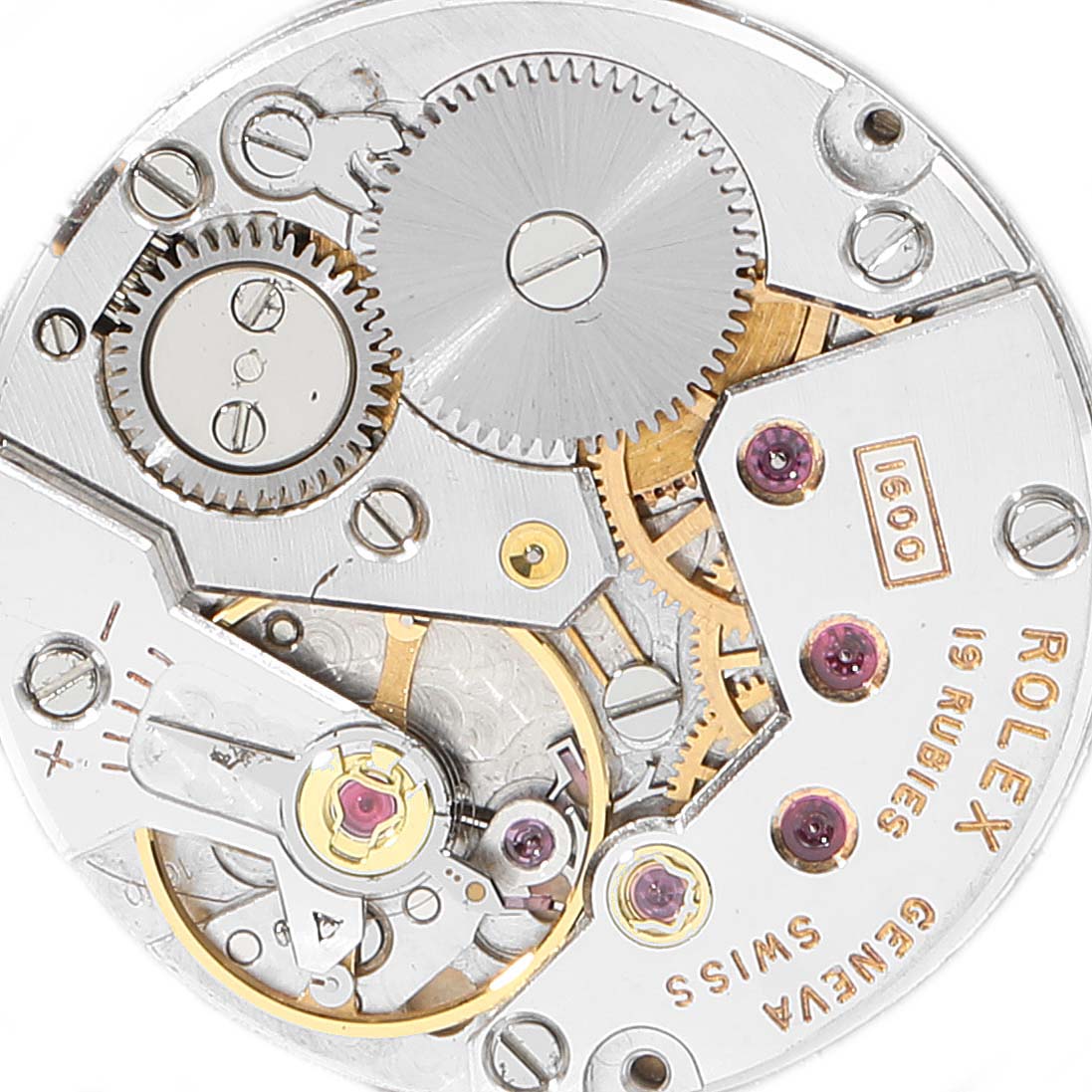 This image shows a close-up of the Rolex Cellini 3804 Men's Yellow Gold Silver Dial 3804 Men's Yellow Gold Silver Dial model's movement, revealing gears and internal mechanisms.