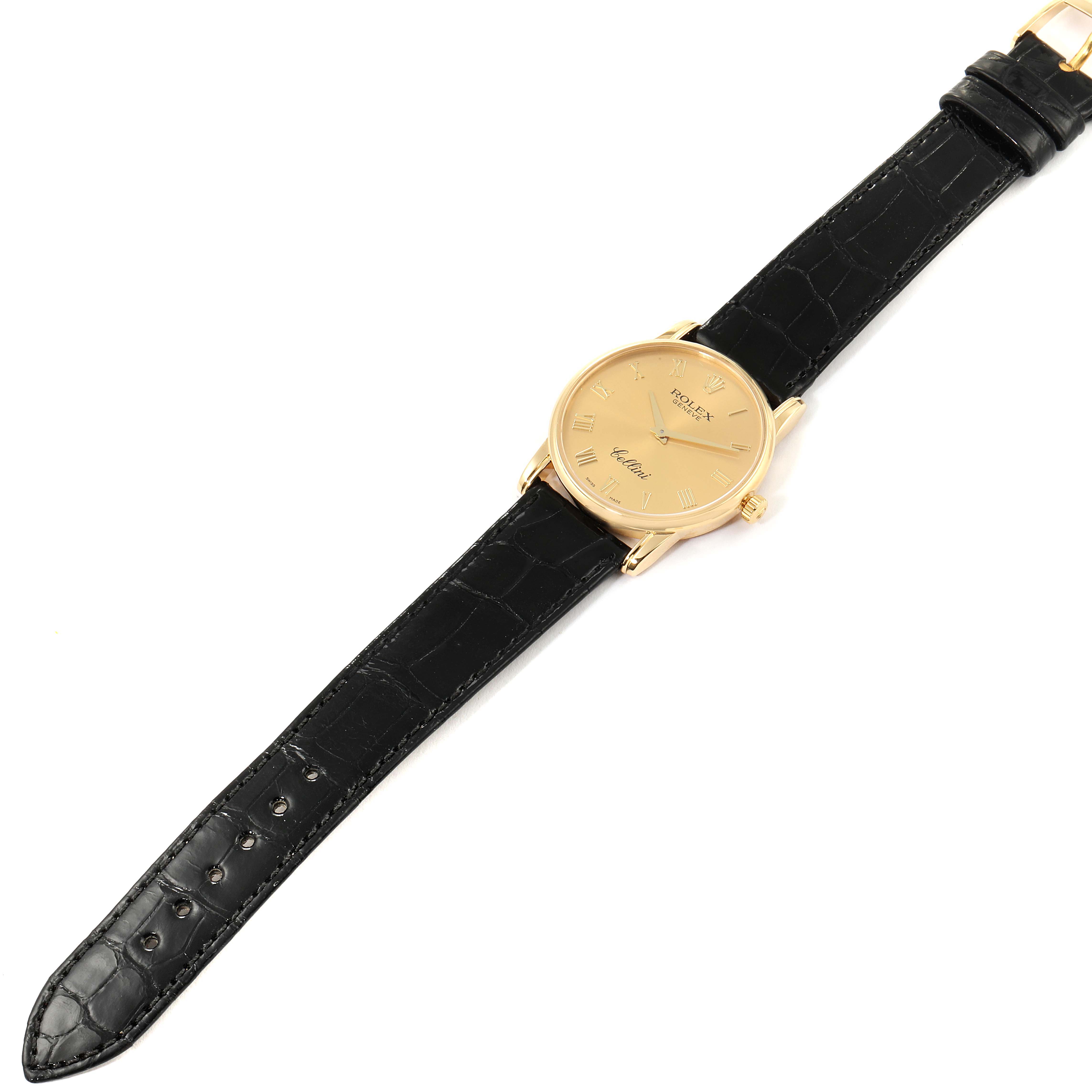 The image shows a Rolex Cellini 5116 Men's Yellow Gold Champagne Dial 5116 Men's Yellow Gold Champagne Dial watch with a gold dial and black leather strap, viewed from above.