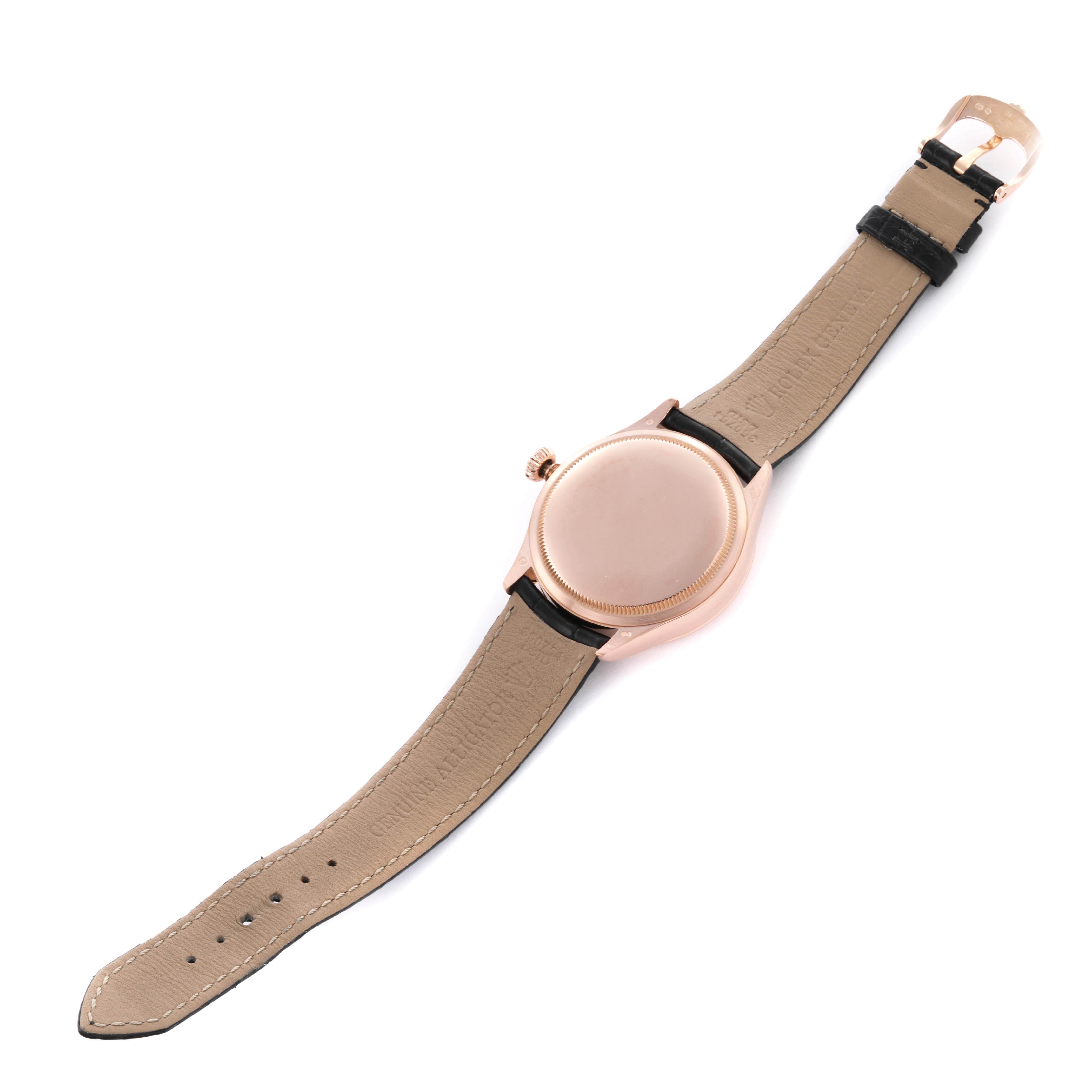 The Rolex Cellini 50515 Men's Rose Gold Silver Dial 50515 Men's Rose Gold Silver Dial watch is shown from the back, featuring the case back, crown, and leather strap.