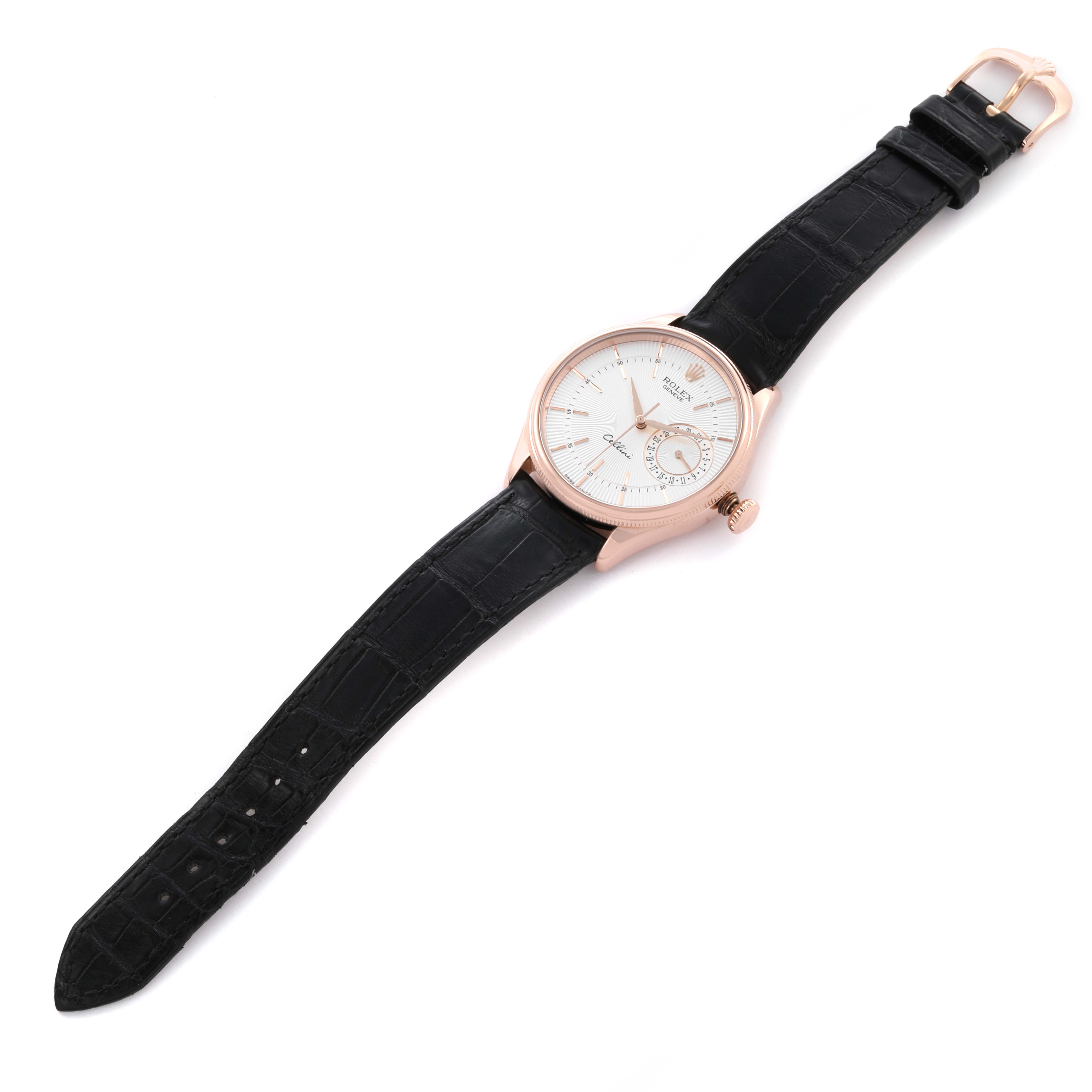 The Rolex Cellini 50515 Men's Rose Gold Silver Dial 50515 Men's Rose Gold Silver Dial watch is shown from an angled top view, displaying its face, leather strap, and clasp.