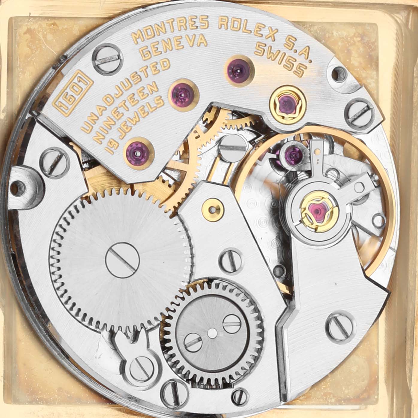 The image shows the intricate movement mechanism of the Vintage Collection Rolex watch from a top-down angle.