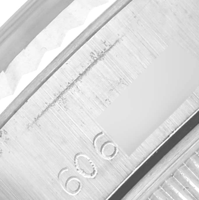 The image shows a close-up of the bezel and serial number area of a Rolex Date 6917 Women's Stainless Steel Silver Dial 6917 Women's Stainless Steel Silver Dial model watch.