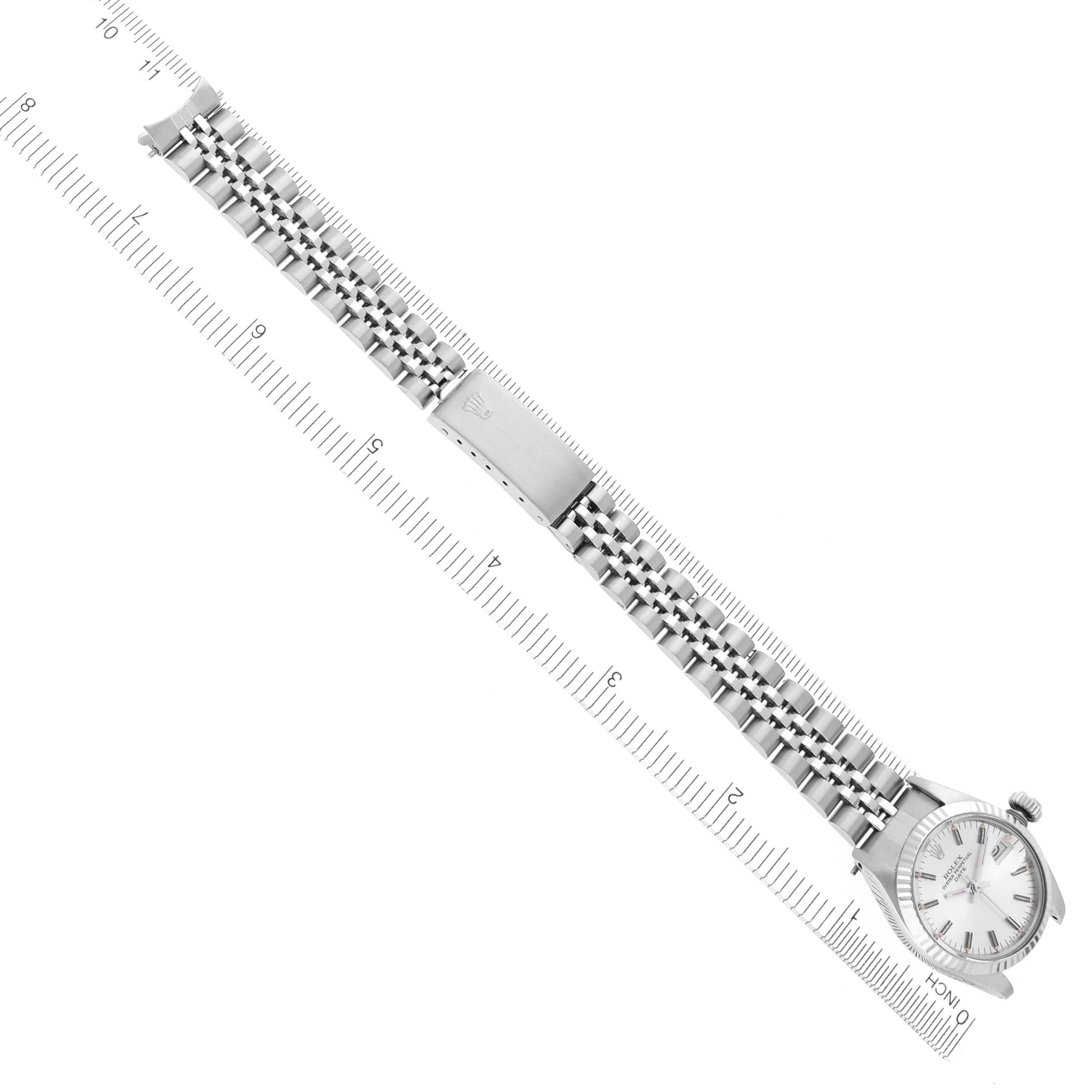 The image shows a top-down view of a Rolex Date 6917 Women's Stainless Steel Silver Dial 6917 Women's Stainless Steel Silver Dial watch, displaying the full bracelet and watch face, with a ruler for scale.