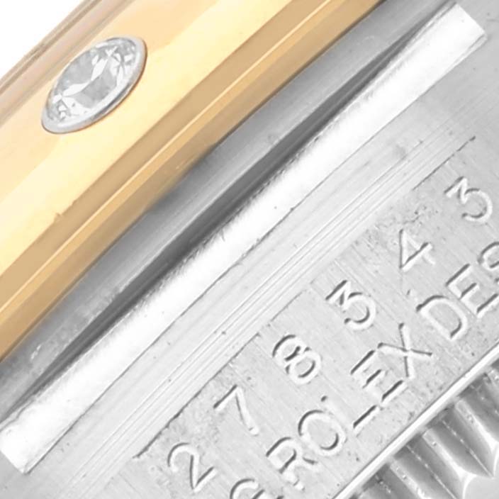 The image shows a close-up of the Rolex Mid-Size 68032 Women's Steel and Gold (two tone) Champagne Dial 68032 Women's Steel and Gold (two tone) Champagne Dial watch, highlighting the engraved case and diamond-set bezel.