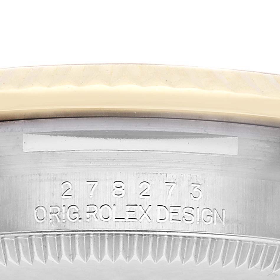 The image shows a side view of the Rolex Mid-Size 278273 Women's Steel and Gold (two tone) Champagne Dial 278273 Women's Steel and Gold (two tone) Champagne Dial model's case, highlighting the engraved serial number and "ORIG ROLEX DESIGN."