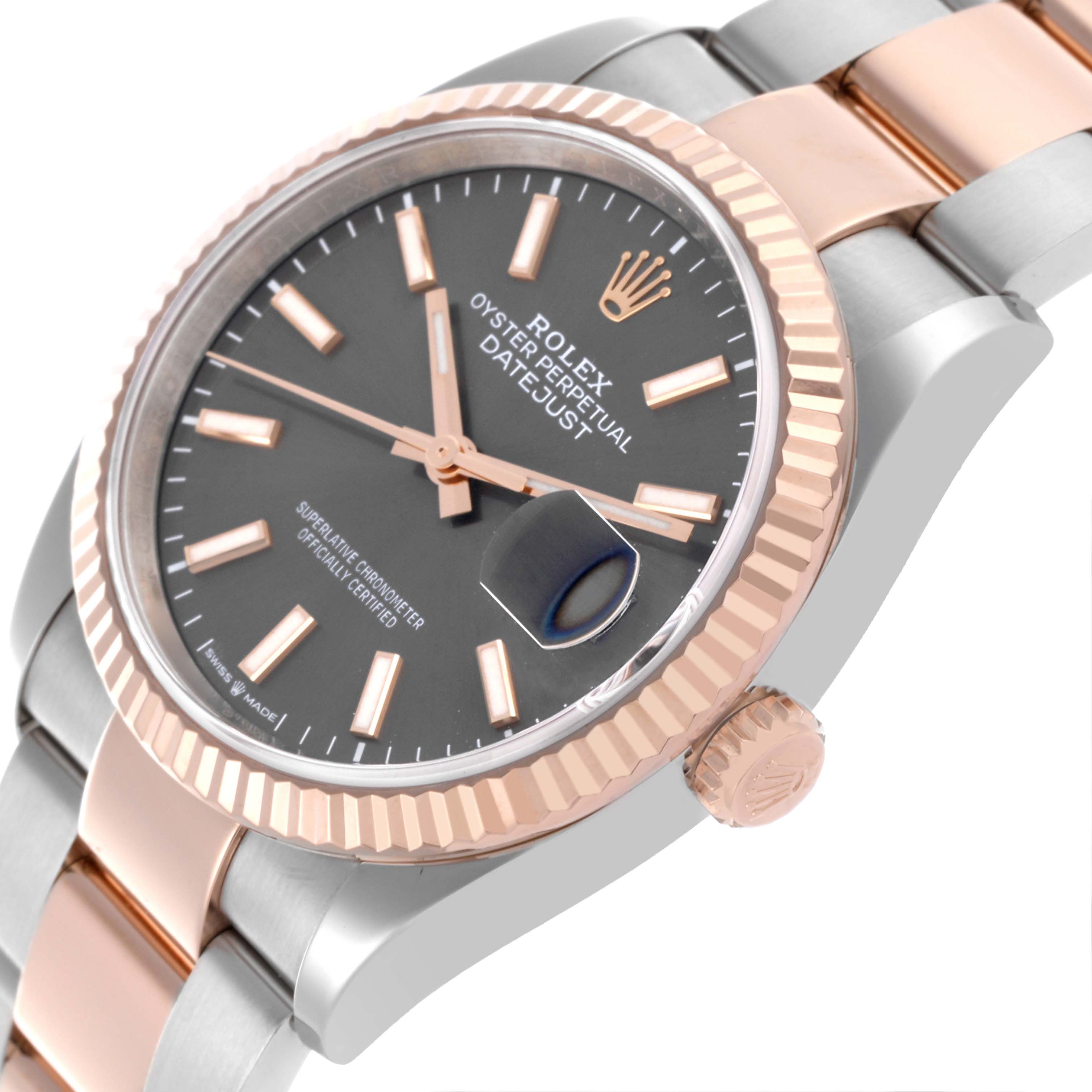 The image shows a side angle of the Rolex Datejust 126231 Men's Steel and Gold (two tone) Grey Dial 126231 Men's Steel and Gold (two tone) Grey Dial, highlighting the bezel, crown, and part of the bracelet.