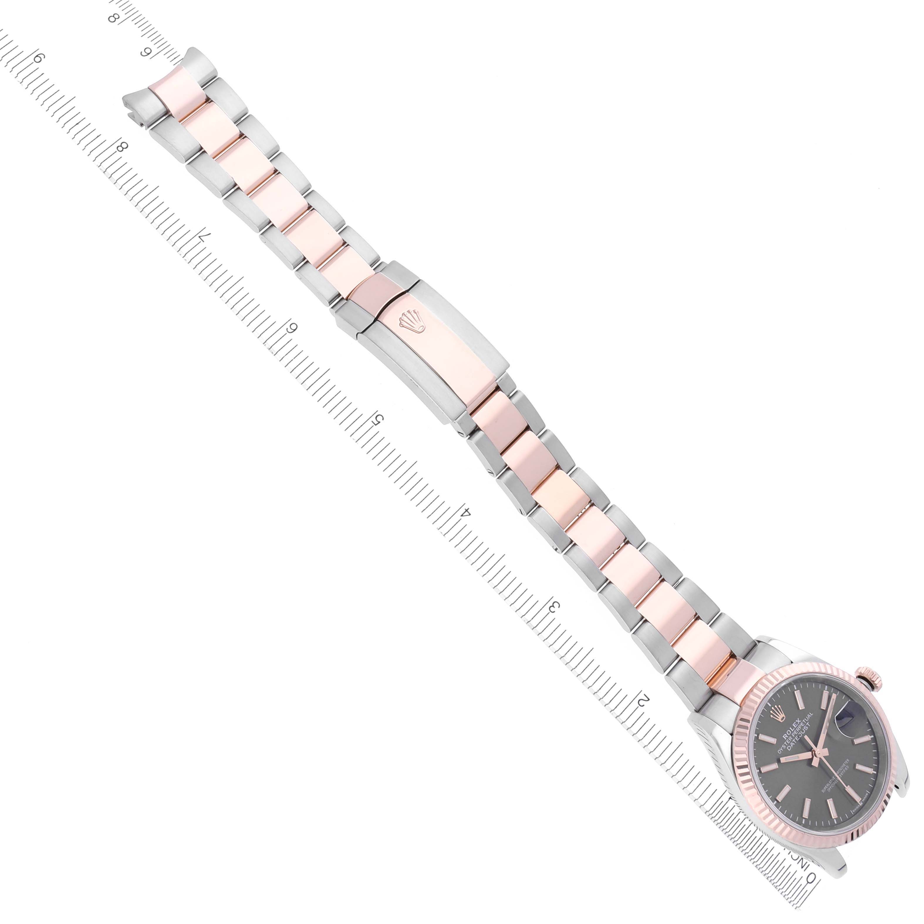 The Rolex Datejust 126231 Men's Steel and Gold (two tone) Grey Dial 126231 Men's Steel and Gold (two tone) Grey Dial watch is shown from a top angle, highlighting the face, bezel, and bracelet with the Rolex clasp.