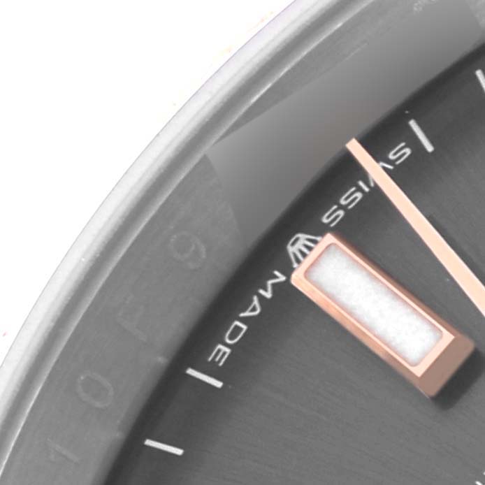 The image shows a close-up of the dial edge, including hour markers and text, of a Rolex Datejust 126231 Men's Steel and Gold (two tone) Grey Dial 126231 Men's Steel and Gold (two tone) Grey Dial watch.