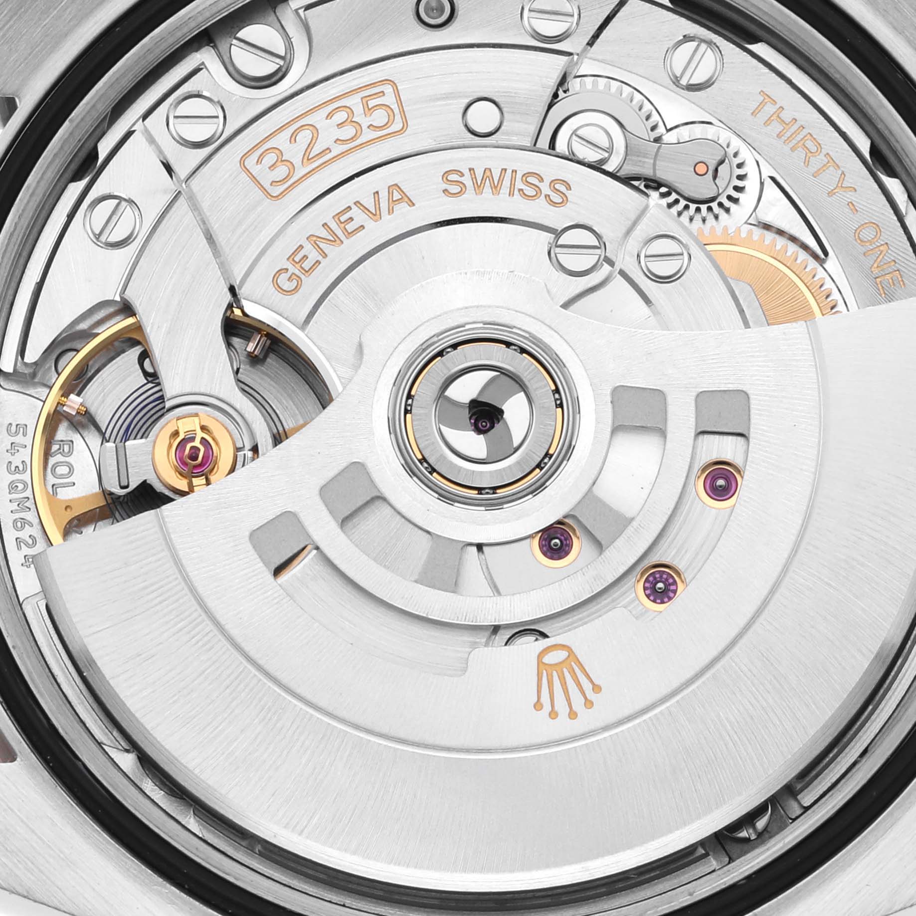 This image shows a close-up of the movement inside a Rolex Datejust 126231 Men's Steel and Gold (two tone) Grey Dial 126231 Men's Steel and Gold (two tone) Grey Dial, highlighting its intricate mechanical components.