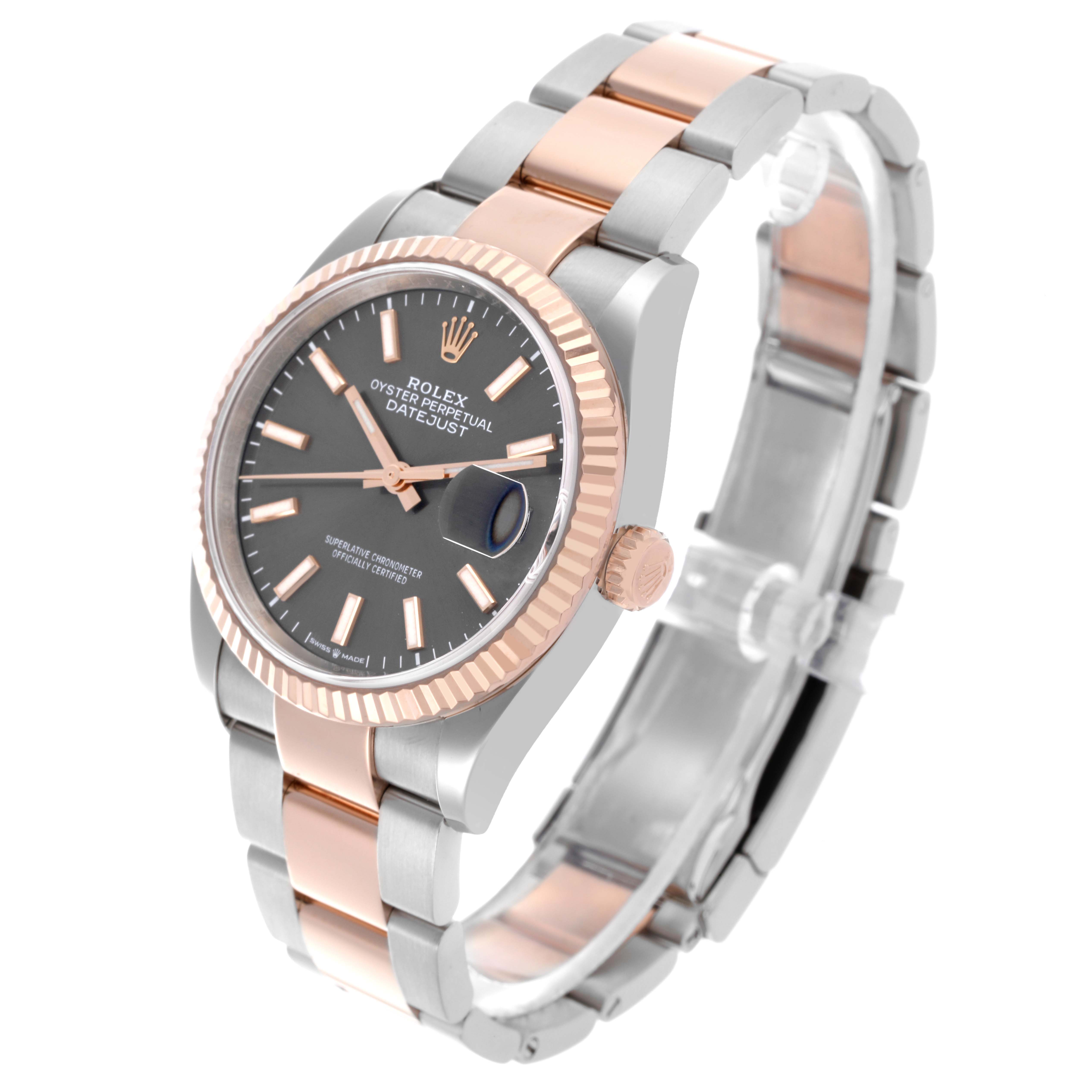The Rolex Datejust 126231 Men's Steel and Gold (two tone) Grey Dial 126231 Men's Steel and Gold (two tone) Grey Dial watch is shown at a three-quarter angle, highlighting the face, fluted bezel, and two-tone bracelet.