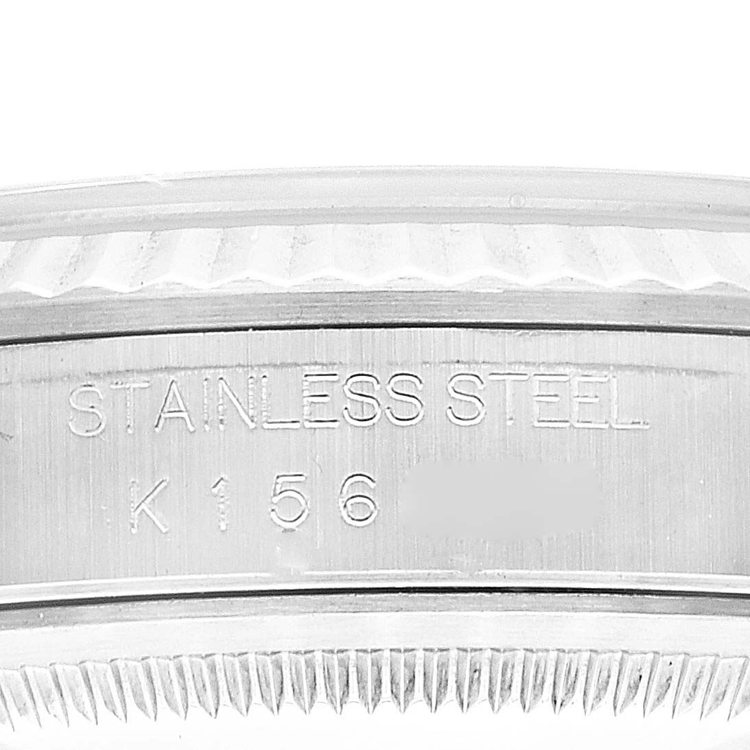 This close-up image shows the side of a Rolex Datejust 16234 Men's Stainless Steel Blue Dial 16234 Men's Stainless Steel Blue Dial watch case, highlighting the "STAINLESS STEEL" engraving.