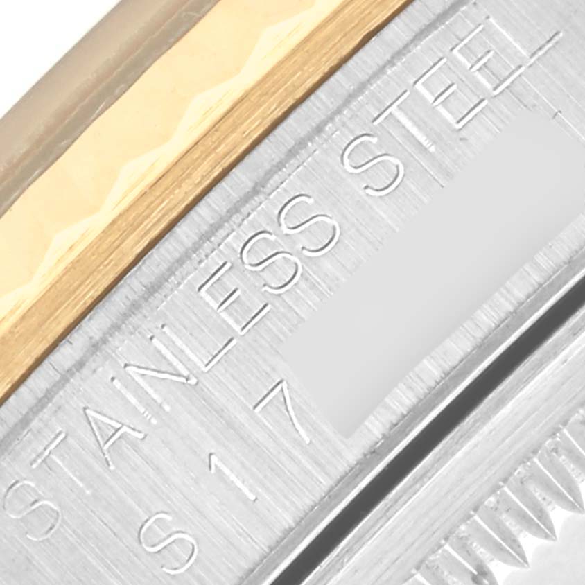 The image shows a close-up of the metallic side of a Rolex Datejust 16233 Men's Steel and Gold (two tone) Black Dial 16233 Men's Steel and Gold (two tone) Black Dial, highlighting the “Stainless Steel” engraving.