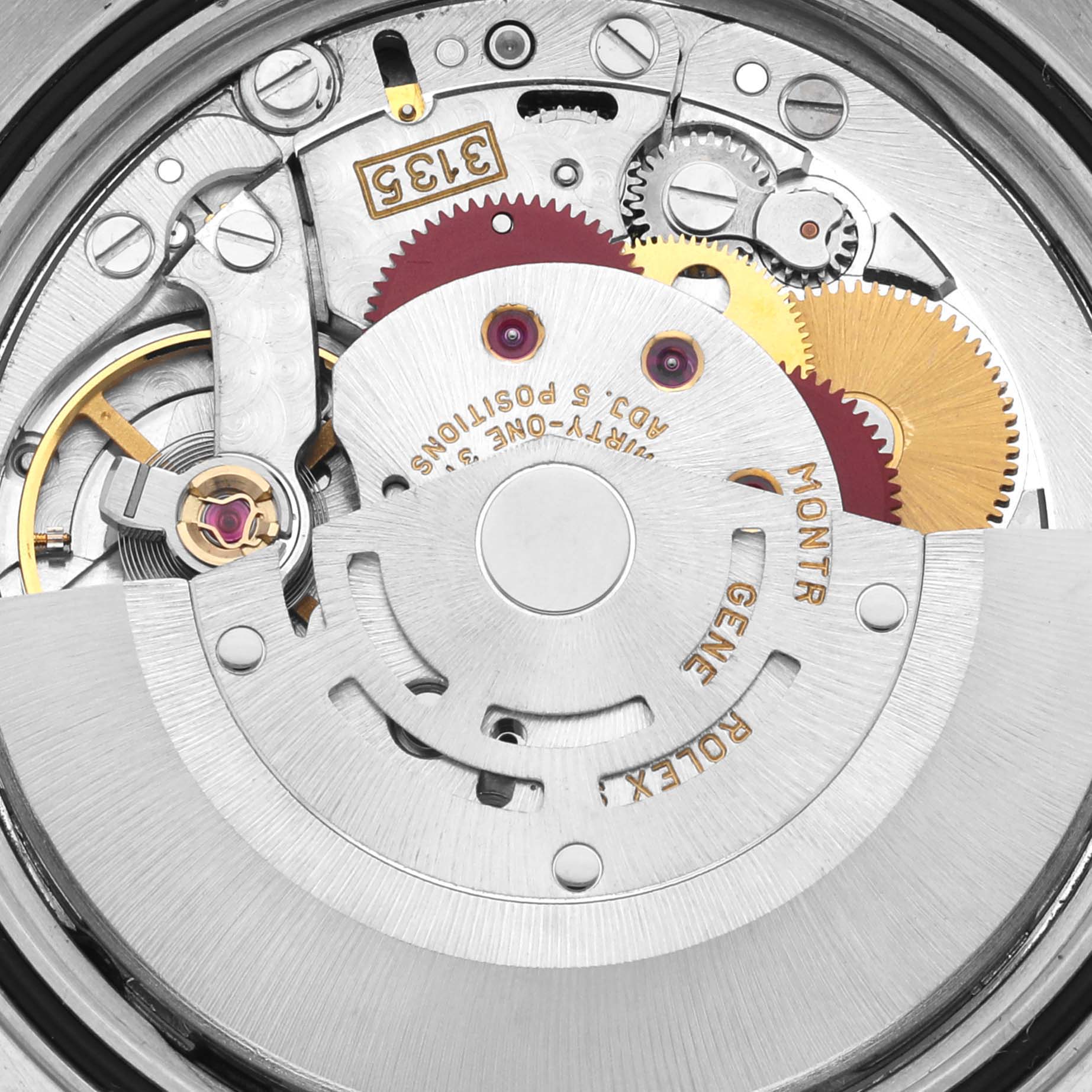 The image shows the movement mechanism of a Rolex Datejust 16233 Men's Steel and Gold (two tone) Black Dial 16233 Men's Steel and Gold (two tone) Black Dial watch from a top-down angle, highlighting gears and components.