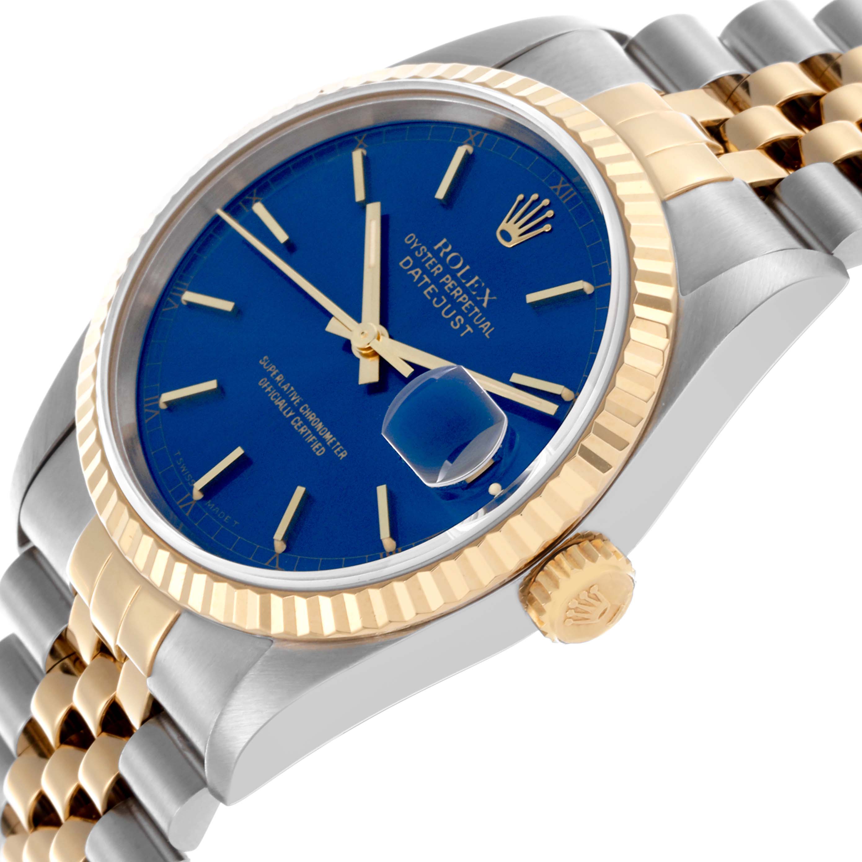 The Rolex Datejust 16233 Men's Steel and Gold (two tone) Blue Dial 16233 Men's Steel and Gold (two tone) Blue Dial watch is shown at a side angle highlighting the blue dial, gold fluted bezel, and jubilee bracelet.