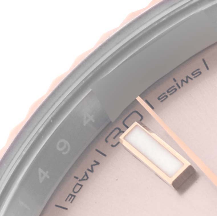 The close-up image shows part of the dial and bezel of the Rolex Datejust 41 126331 Men's Steel and Gold (two tone) Pink Dial 126331 Men's Steel and Gold (two tone) Pink Dial, focusing on the marker and date.
