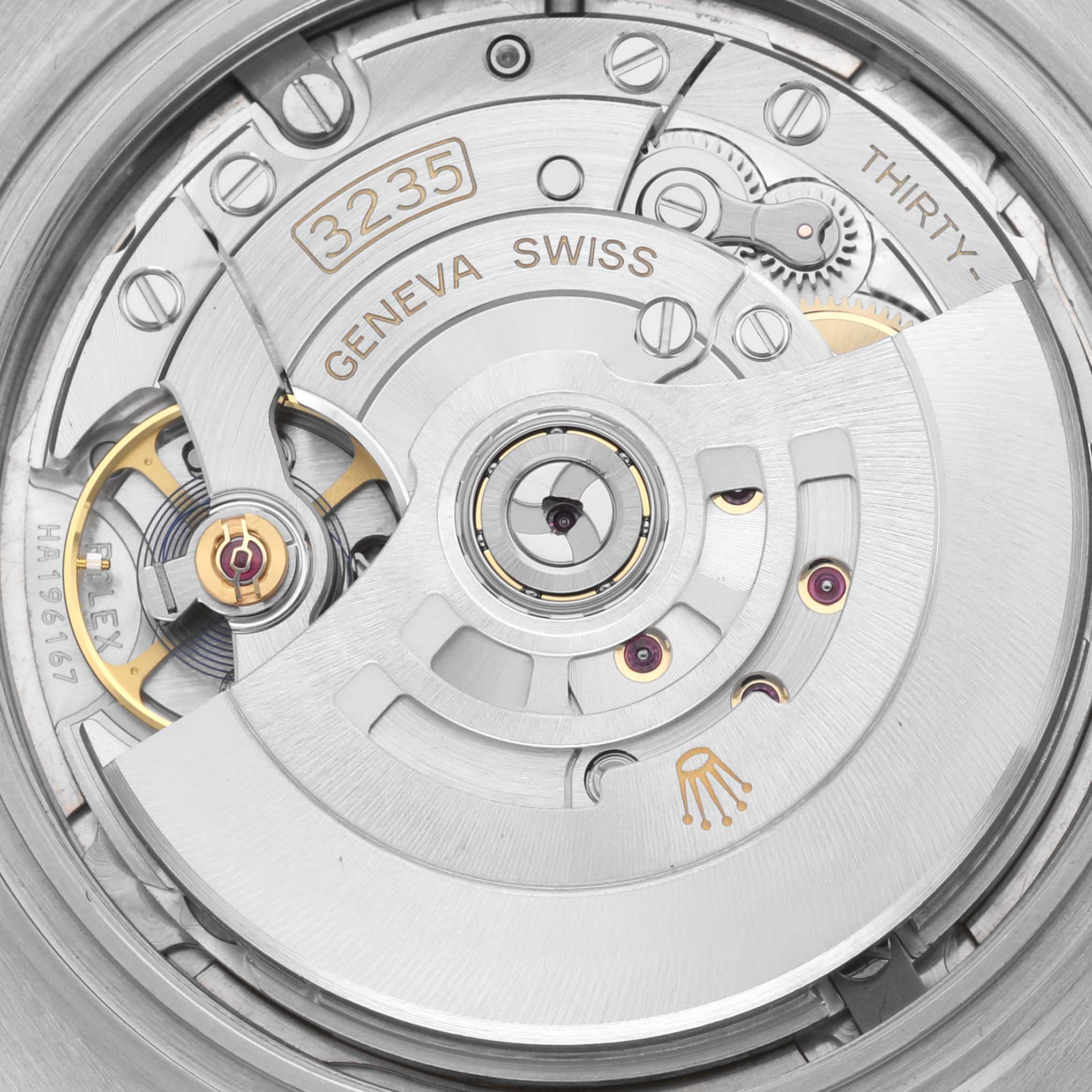 The image shows a detailed close-up of the movement of a Rolex Datejust 41 126331 Men's Steel and Gold (two tone) Pink Dial 126331 Men's Steel and Gold (two tone) Pink Dial, highlighting its mechanical components.