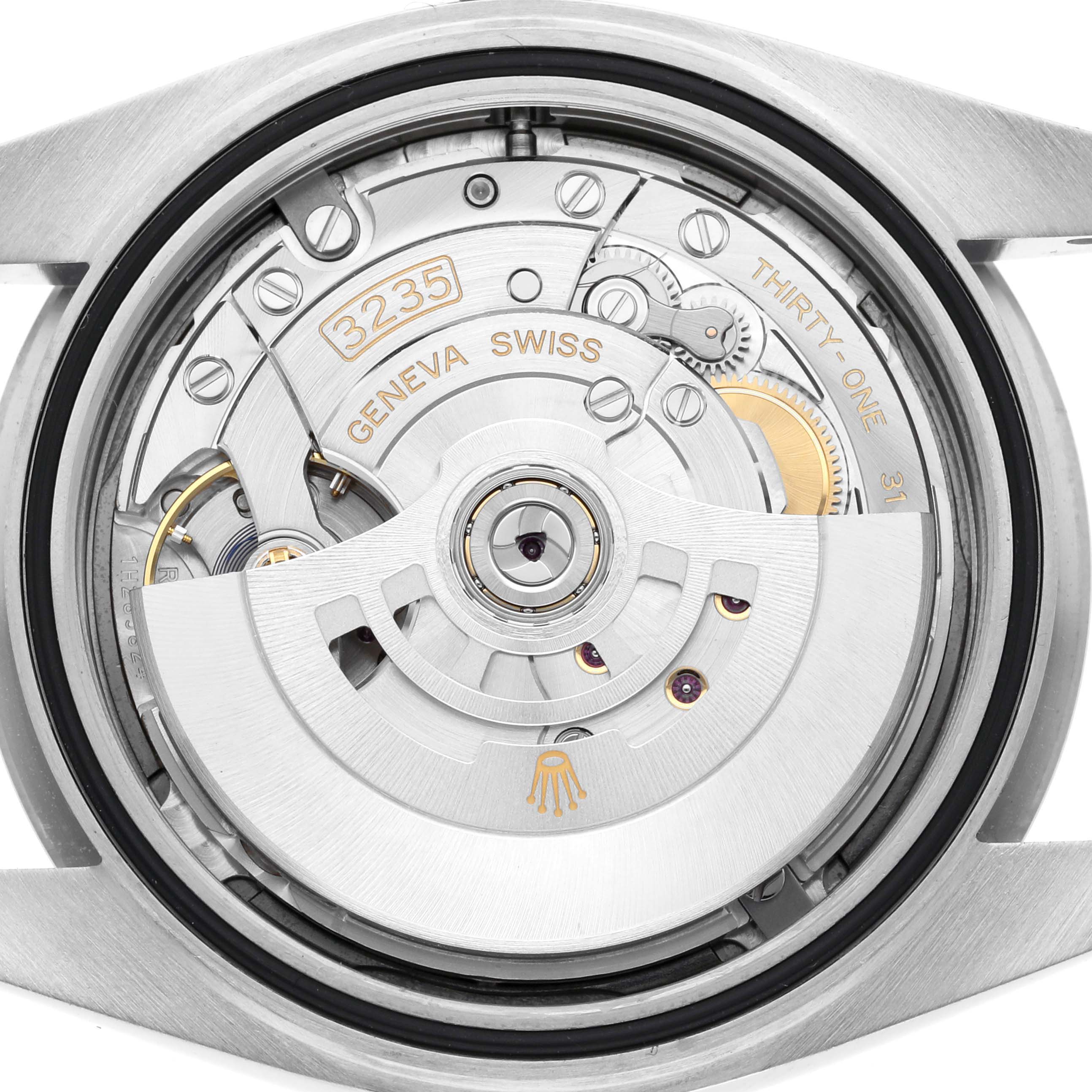 The image shows the back view of a Rolex Datejust 41 126334 Men
s Stainless Steel Blue Dial 126334 Men
s Stainless Steel Blue Dial, focusing on its movement and internal mechanisms.