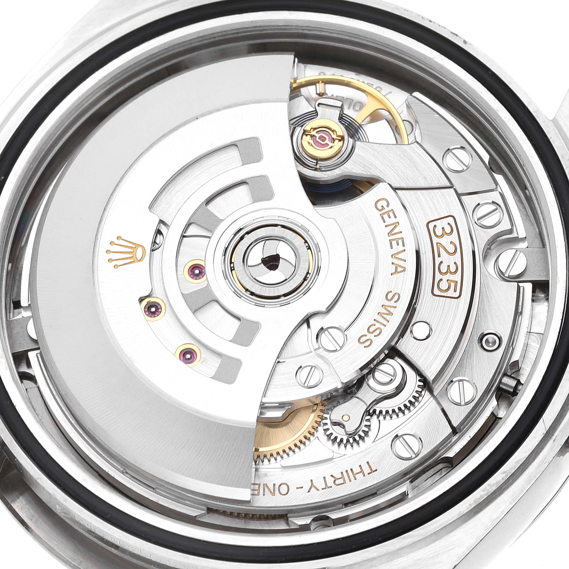The image shows a detailed view of the movement of a Rolex Datejust 41 126334 Men
s Stainless Steel Grey Dial 126334 Men
s Stainless Steel Grey Dial model, highlighting its intricate mechanical components.