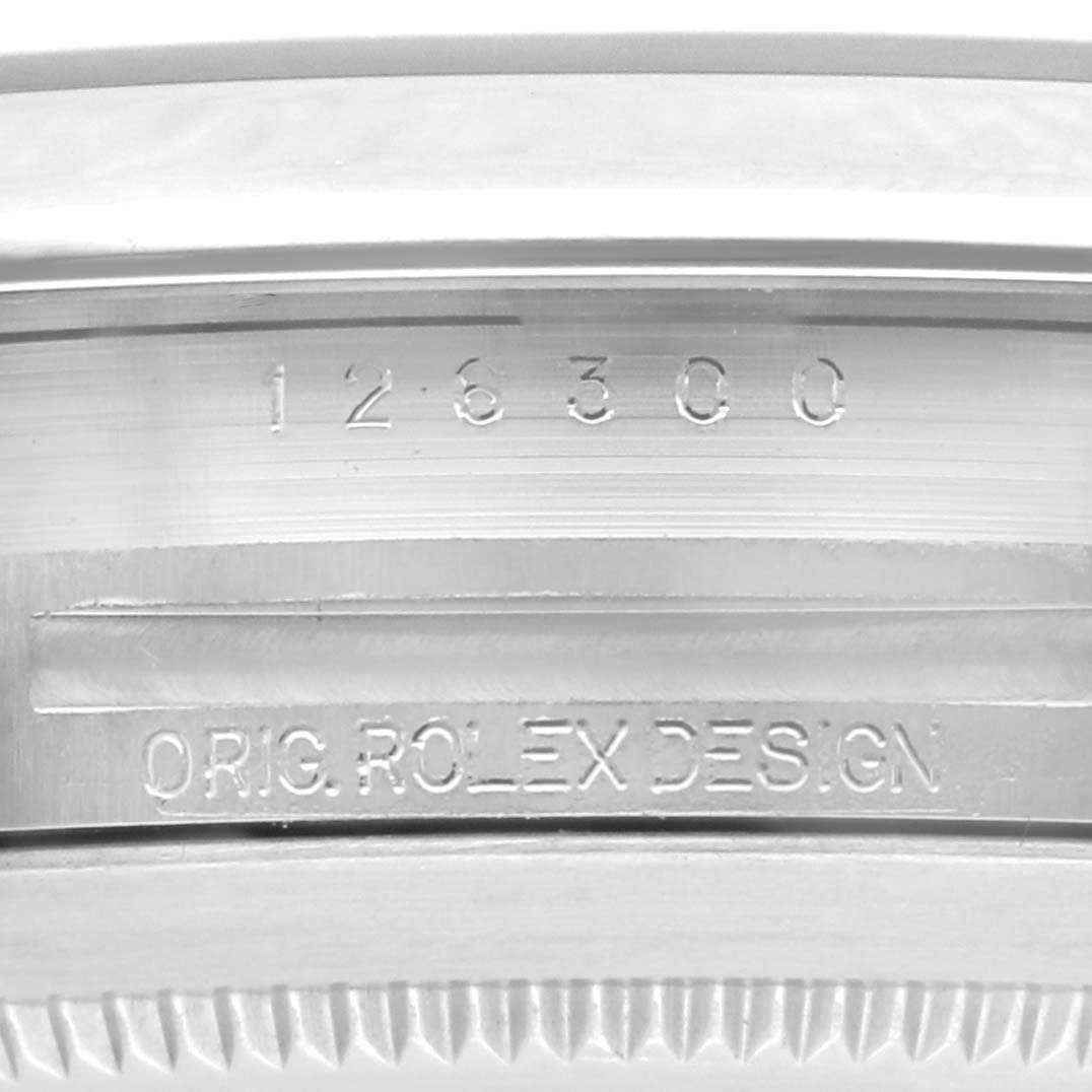 The image shows the side engraving of a Rolex Datejust 41 126300 Men's Stainless Steel Grey Dial 126300 Men's Stainless Steel Grey Dial, highlighting the model number and "ORIG. ROLEX DESIGN."