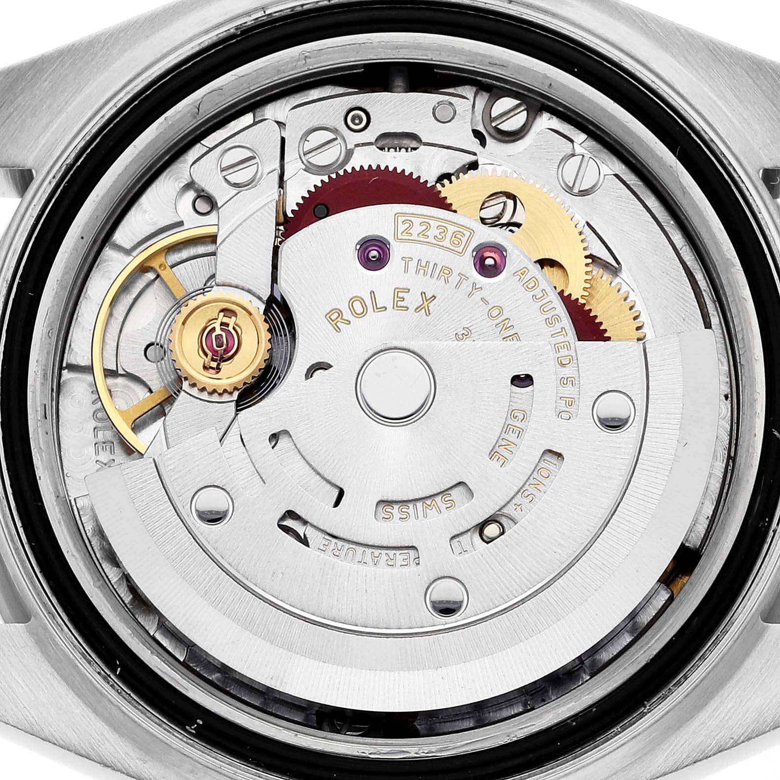 The image shows a close-up of the Rolex Datejust 279171 Women's Steel and Gold (two tone) Brown Dial 279171 Women's Steel and Gold (two tone) Brown Dial's movement, displaying gears and intricate internal mechanisms.