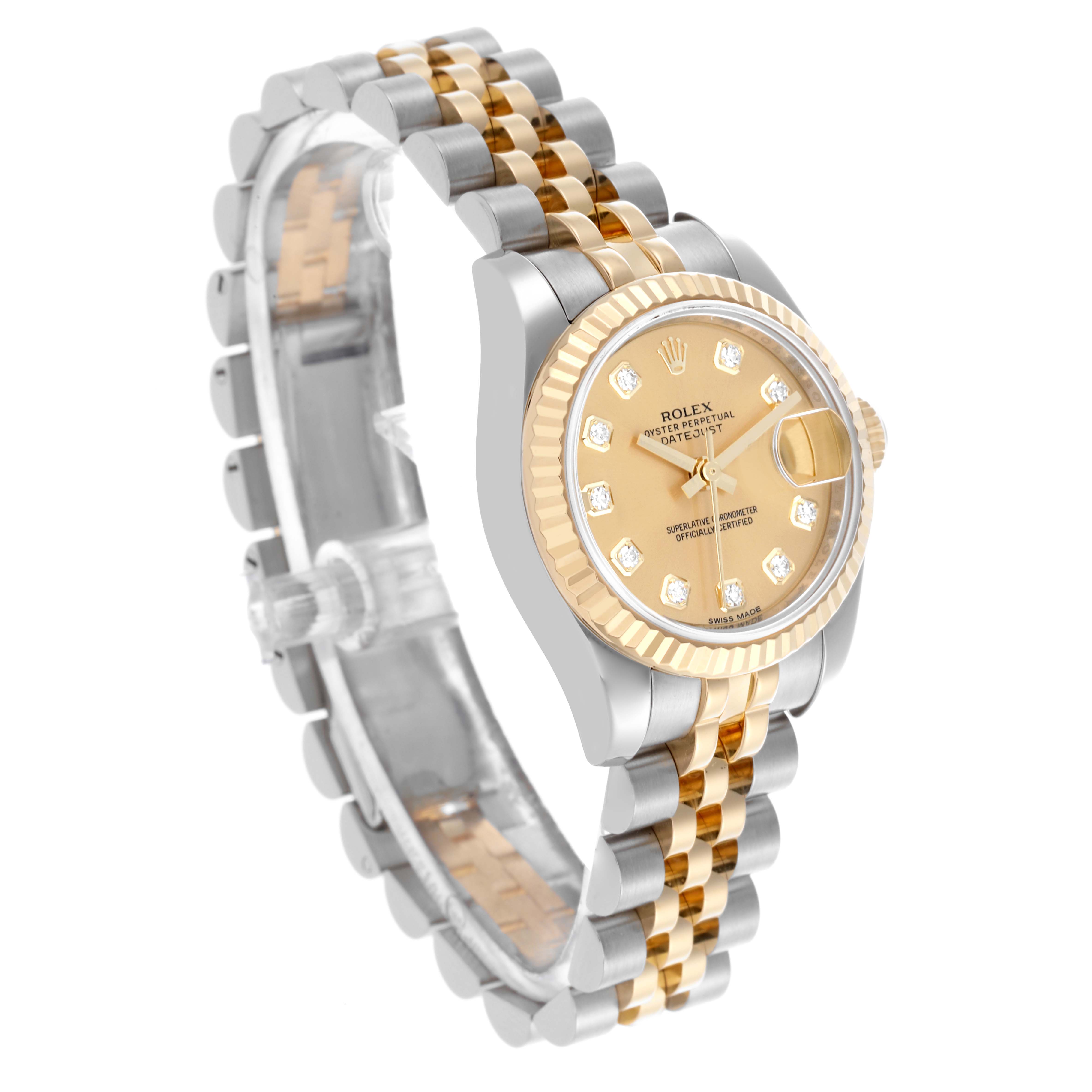 The Rolex Datejust 179173 Women's Steel and Gold (two tone) Champagne Dial 179173 Women's Steel and Gold (two tone) Champagne Dial watch is shown from a front angle, highlighting the dial, bezel, and two-tone bracelet.