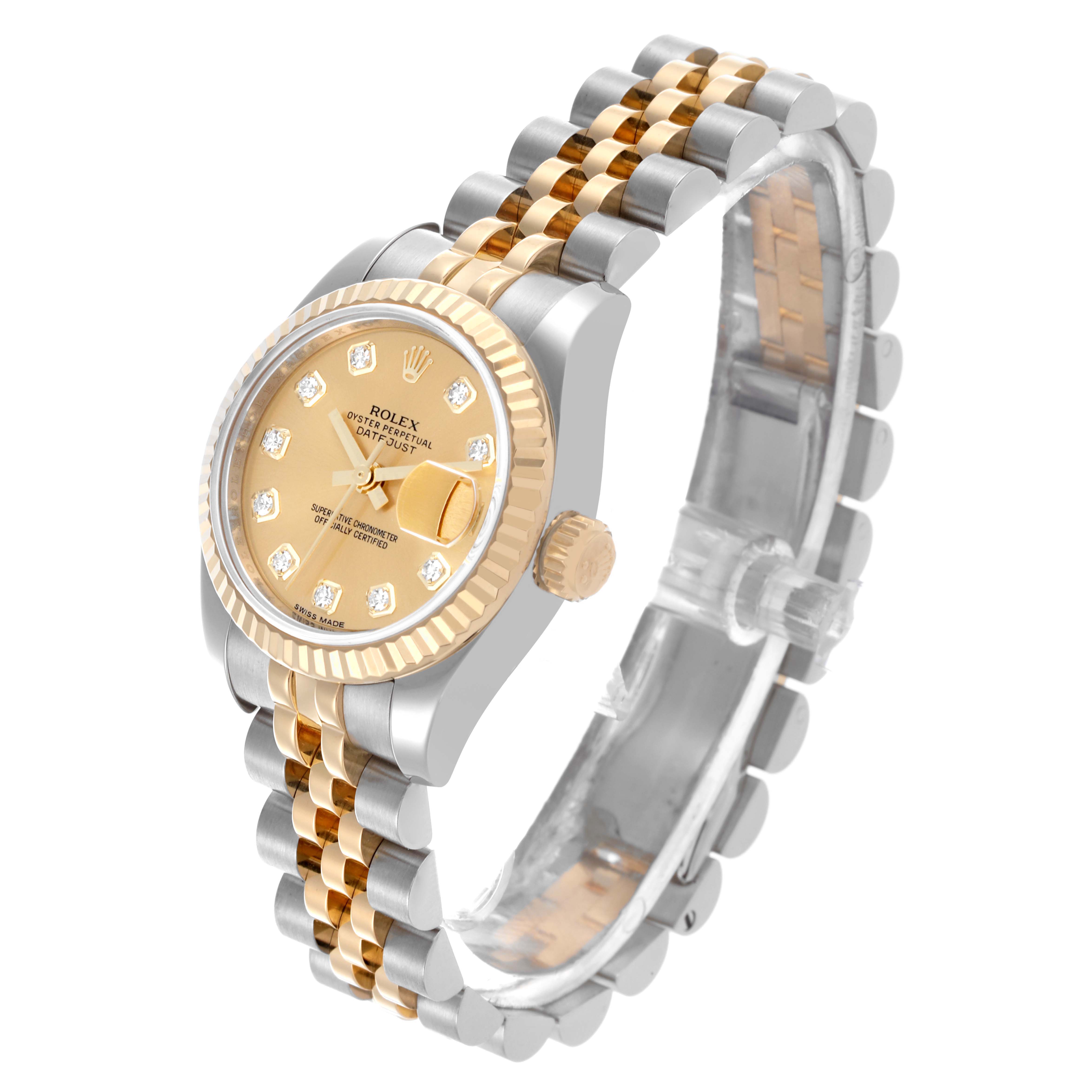 The Rolex Datejust 179173 Women's Steel and Gold (two tone) Champagne Dial 179173 Women's Steel and Gold (two tone) Champagne Dial watch is shown at a three-quarter angle, highlighting the gold and silver bracelet, dial, and fluted bezel.