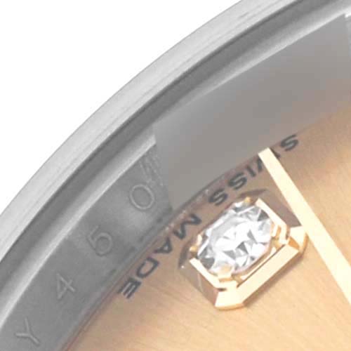The image shows a close-up of the dial's edge of a Rolex Datejust 179173 Women's Steel and Gold (two tone) Champagne Dial 179173 Women's Steel and Gold (two tone) Champagne Dial, highlighting the "Swiss Made" text and a diamond hour marker.